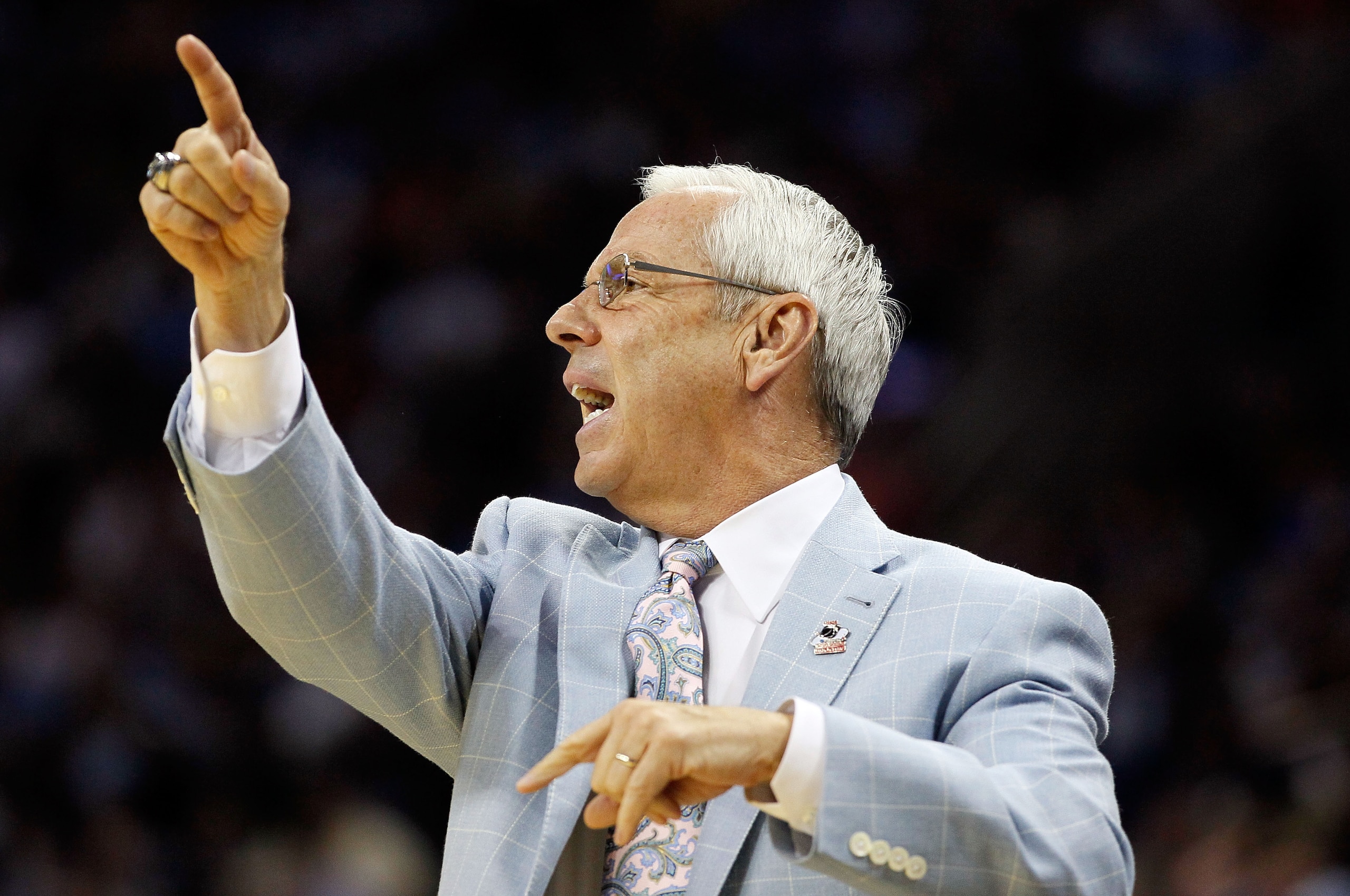 CHARLOTTE, NC - MARCH 20:  Head coach Roy Williams of the North Carolina Tar Heels reacts while taking on the Washington Huskies during the third round of the 2011 NCAA men's basketball tournament at Time Warner Cable Arena on March 20, 2011 in Charlotte,
