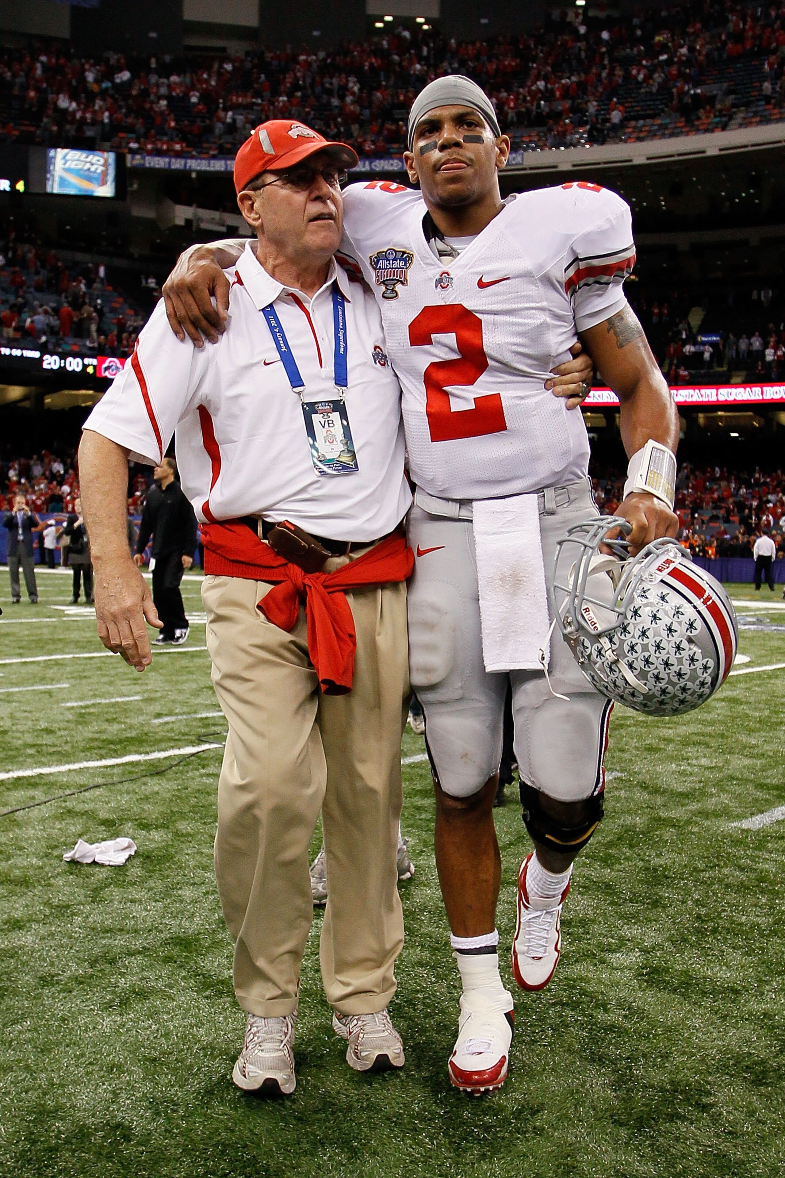 NEW ORLEANS, LA - JANUARY 04: (M) Quarterback Terrelle Pryor #2 of the Ohio State Buckeyes is helped off the field by a member of the Buckeyes support team after the Buckeyes 31-26 victory against the Arkansas Razorbacks during the Allstate Sugar Bowl at NEW ORLEANS, LA - JANUARY 04: (M) Quarterback Terrelle Pryor #2 of the Ohio State Buckeyes is helped off the field by a member of the Buckeyes support team after the Buckeyes 31-26 victory against the Arkansas Razorbacks during the Allstate Sugar Bowl at