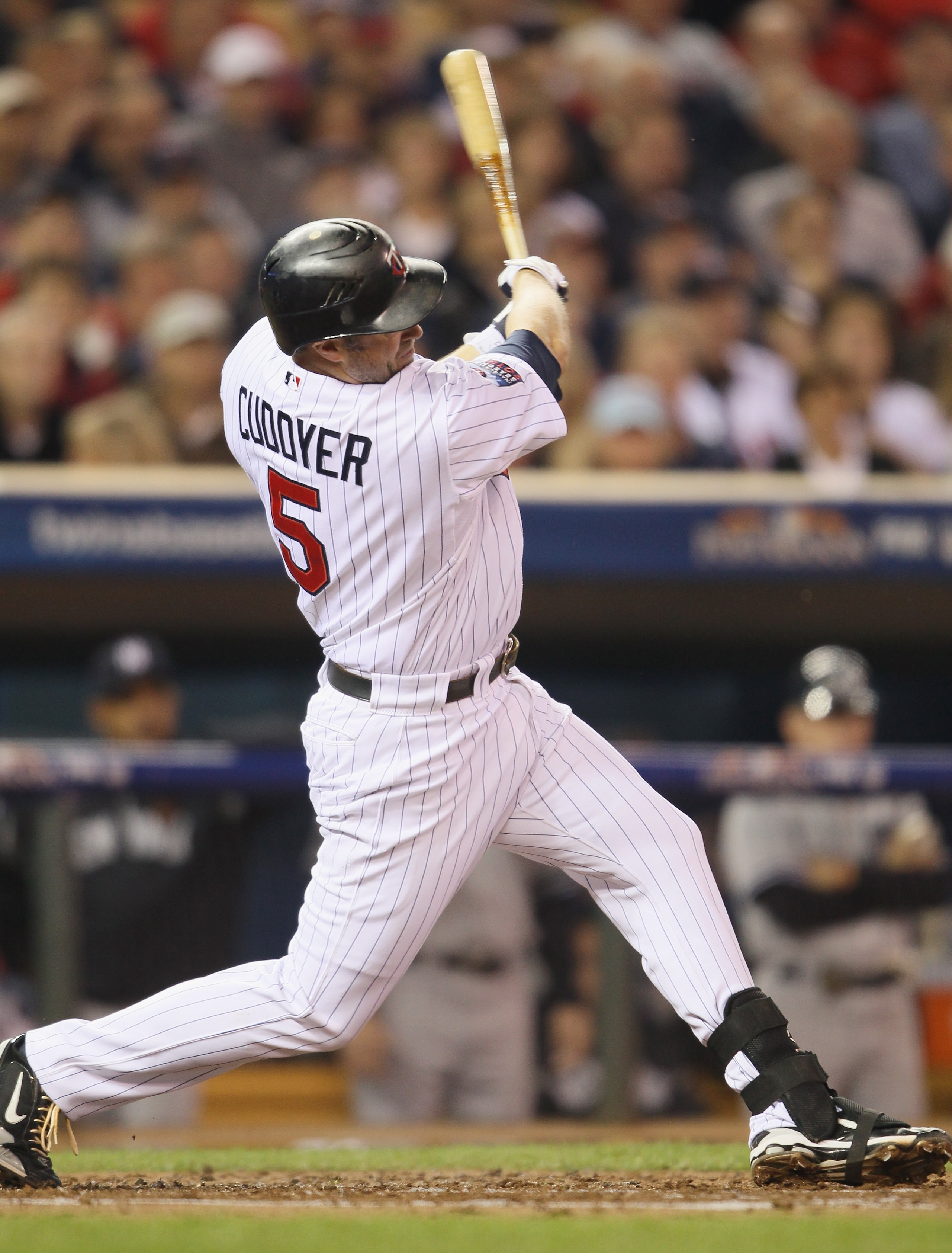 MINNEAPOLIS - OCTOBER 06: Michael Cuddyer #5 of the Minnesota Twins hits a two run homer in the second inning against the New York Yankees during game one of the ALDS on October 6, 2010 at Target Field in Minneapolis, Minnesota. (Photo by Elsa/Getty Ima MINNEAPOLIS - OCTOBER 06: Michael Cuddyer #5 of the Minnesota Twins hits a two run homer in the second inning against the New York Yankees during game one of the ALDS on October 6, 2010 at Target Field in Minneapolis, Minnesota. (Photo by Elsa/Getty Ima