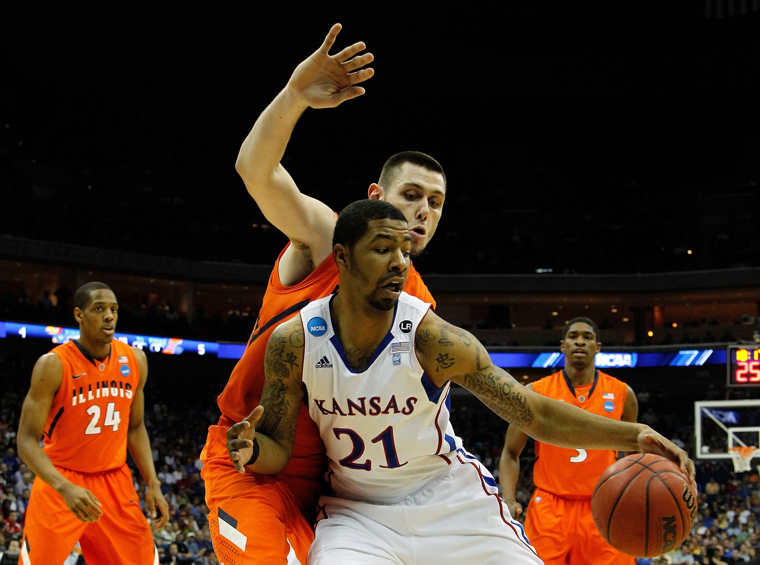 TULSA, OK - MARCH 20:  Markieff Morris #21 of the Kansas Jayhawks drives with the ball against Mike Tisdale #54 of the Illinois Fighting Illini during the third round of the 2011 NCAA men's basketball tournament at BOK Center on March 20, 2011 in Tulsa, O