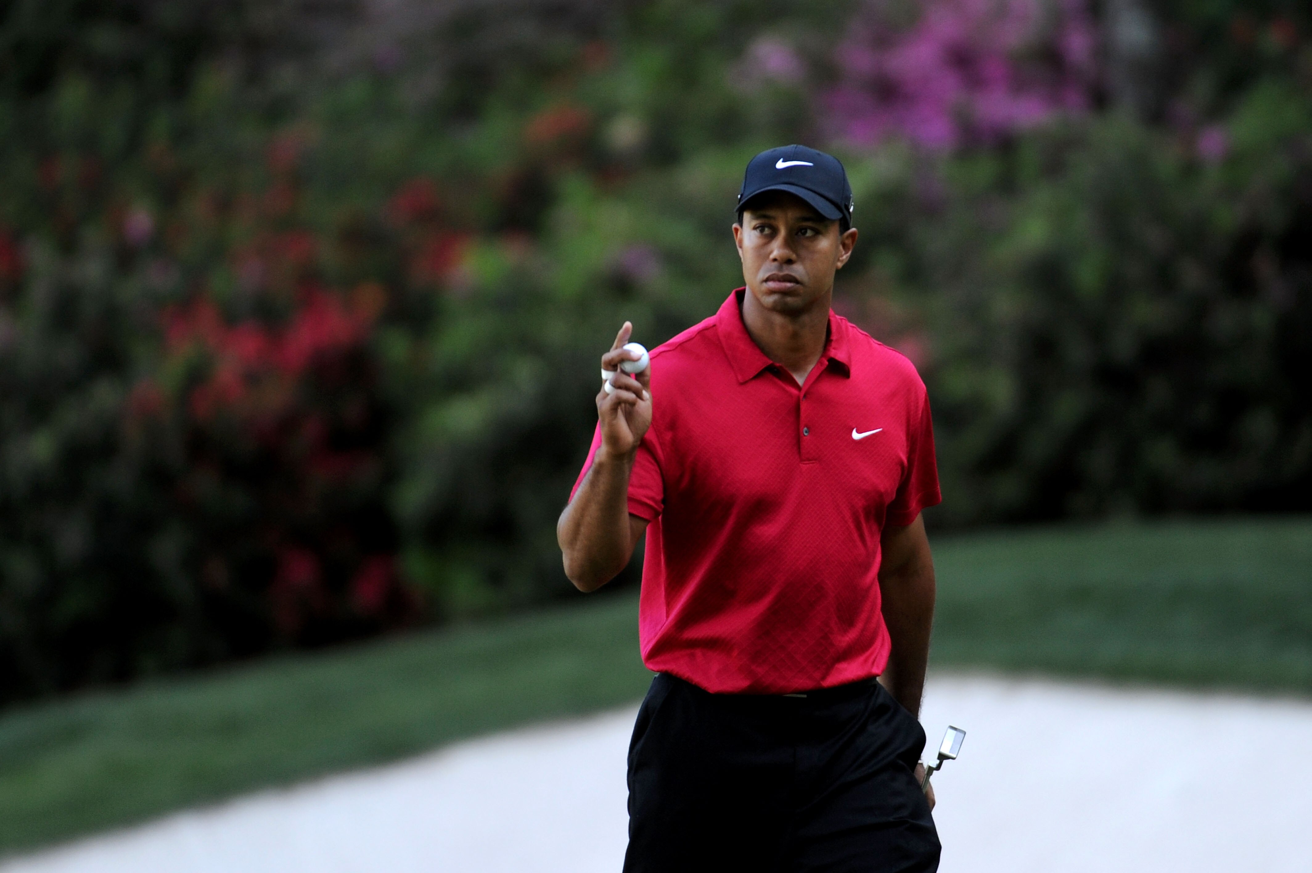 AUGUSTA, GA - APRIL 11:  Tiger Woods celebrates after a birdie putt on the 13th hole during the final round of the 2010 Masters Tournament at Augusta National Golf Club on April 11, 2010 in Augusta, Georgia.  (Photo by Harry How/Getty Images)
