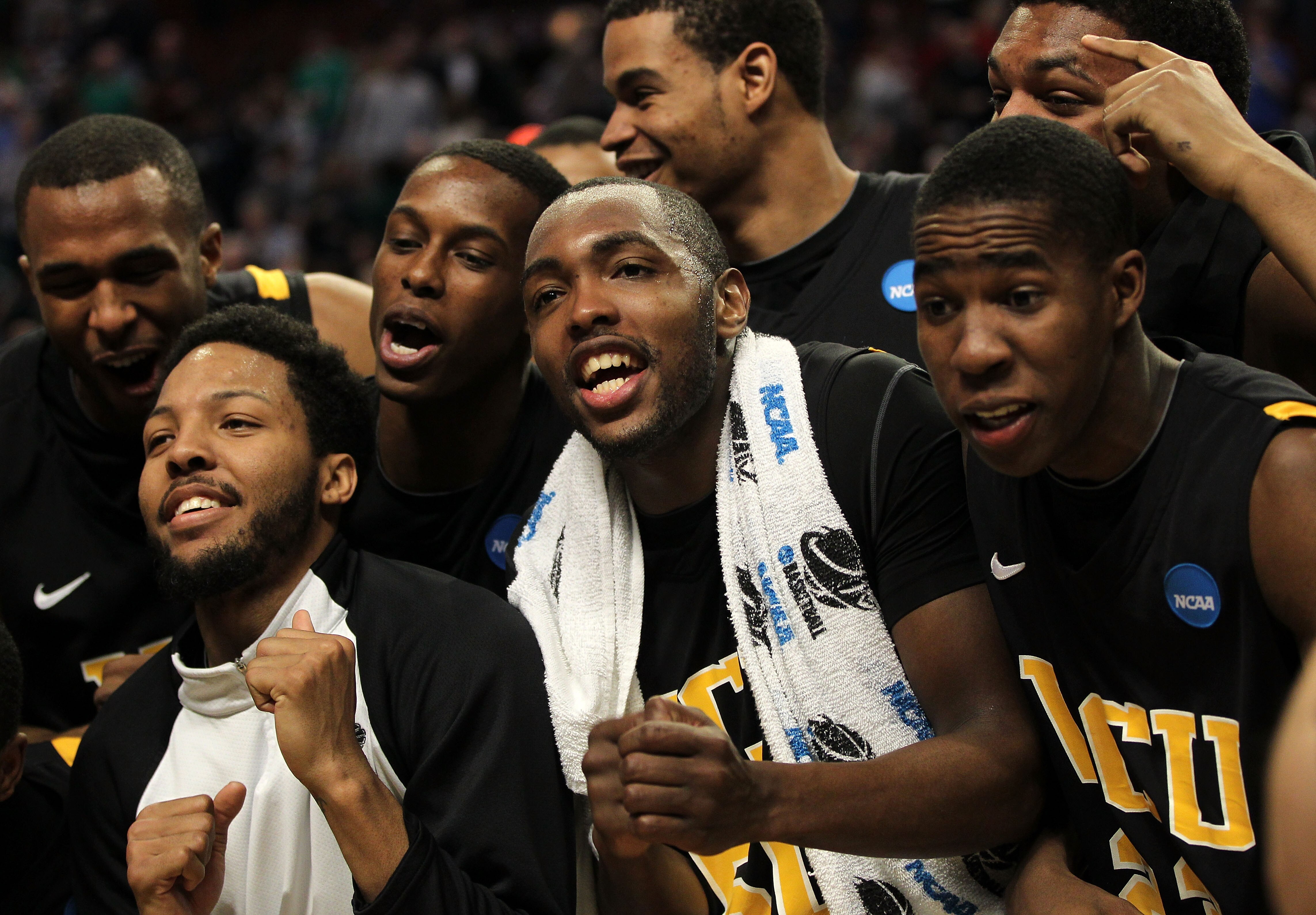 CHICAGO, IL - MARCH 20:  Ed Nixon #50, Brandon Rozzell #32 and teammates celebrate their win over the Purdue Boilermakers in the second half during the third round of the 2011 NCAA men's basketball tournament at the United Center on March 20, 2011 in Chic