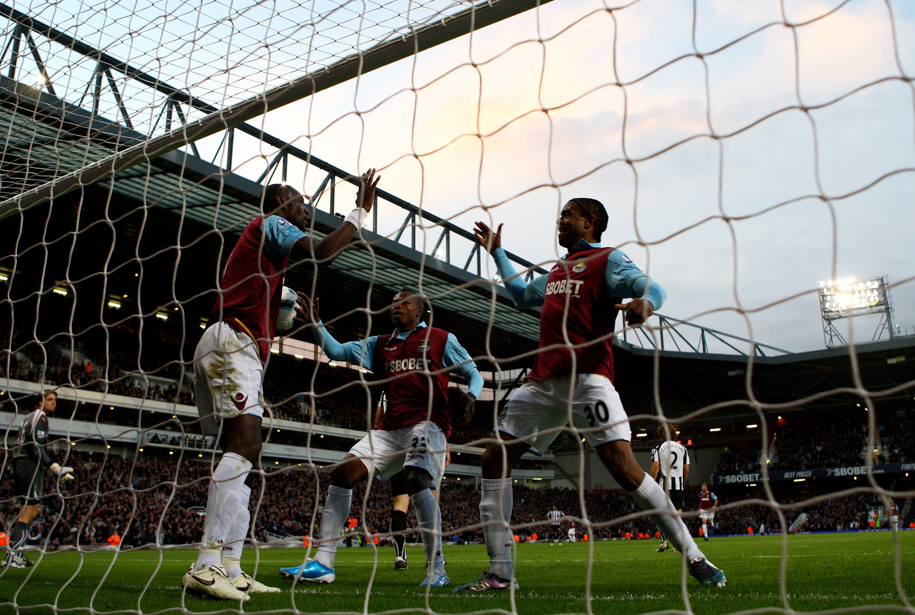LONDON, ENGLAND - OCTOBER 23:  Frederic Piquionne of West Ham congratulates team mate Carlton Cole on scoring the opening goal during the Barclays Premier League match between West Ham United and Newcastle United at The Boleyn Ground on October 23, 2010 i
