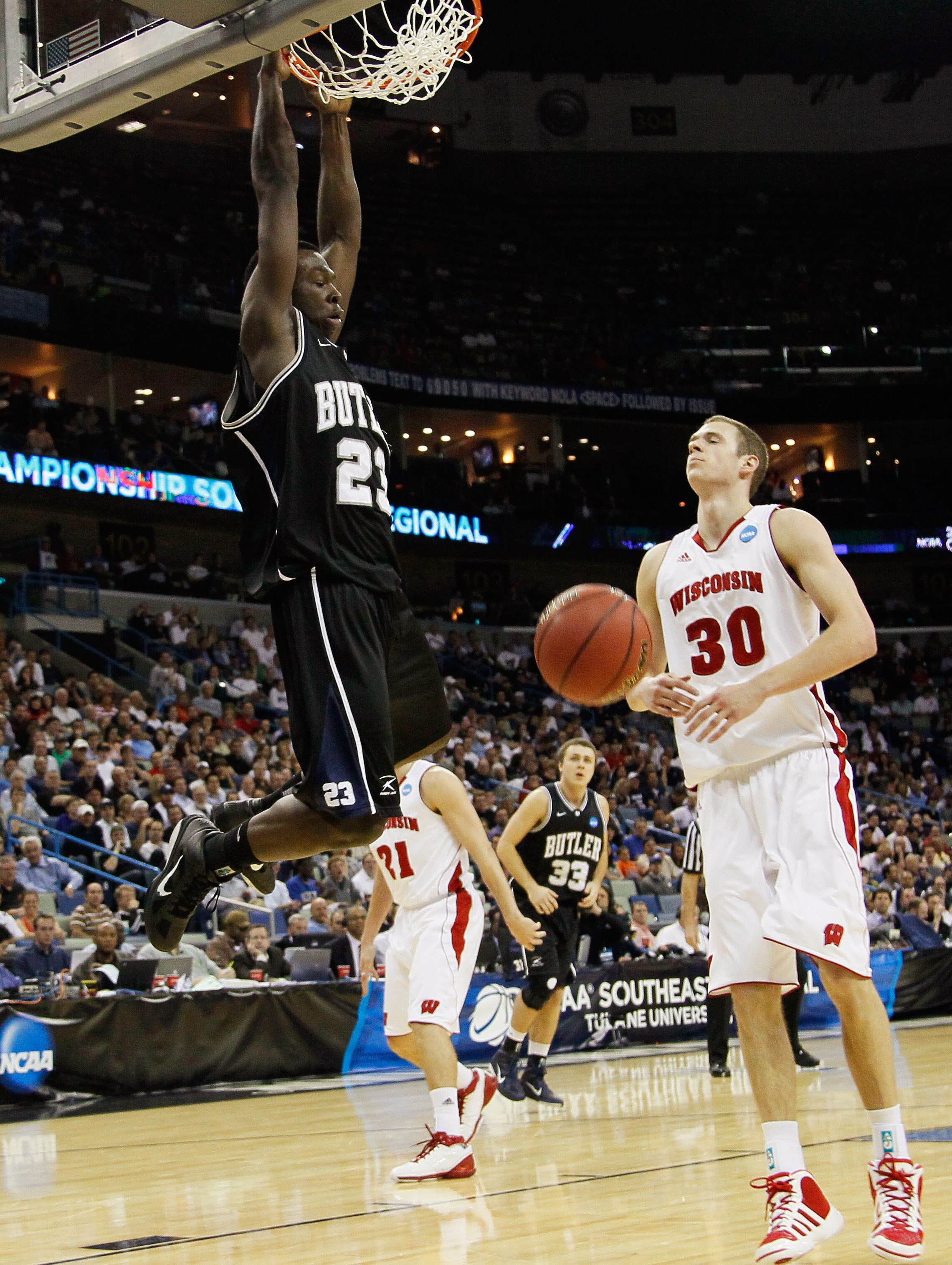 NEW ORLEANS, LA - MARCH 24:  Khyle Marshall #23 of the Butler Bulldogs dunks in front of Jon Leuer #30 of the Wisconsin Badgers during the Southeast regional of the 2011 NCAA men's basketball tournament at New Orleans Arena on March 24, 2011 in New Orlean