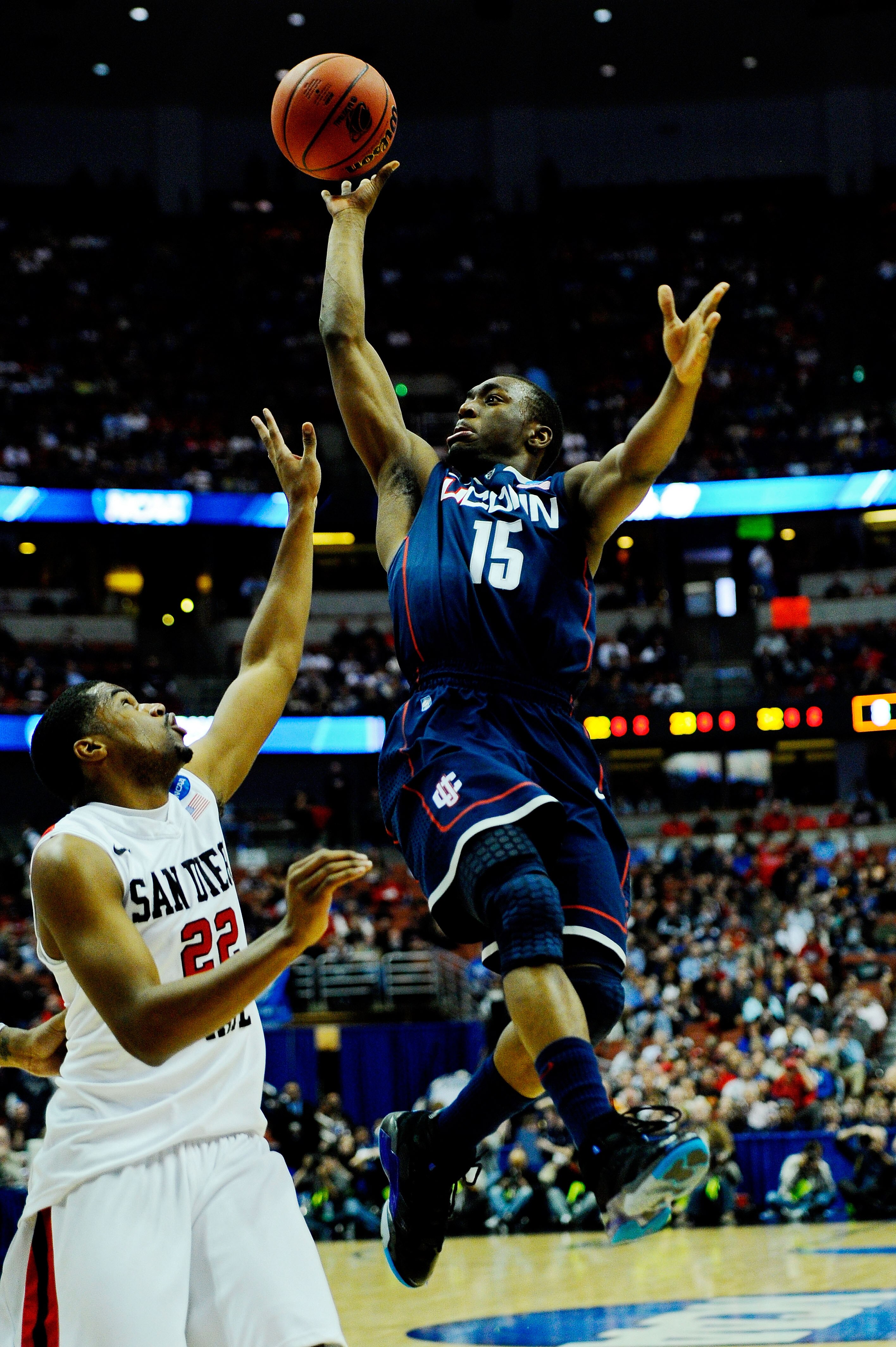 ANAHEIM, CA - MARCH 24:  Kemba Walker #15 of the Connecticut Huskies drives to the basket against Chase Tapley #22 of the San Diego State Aztecs during the west regional semifinal of the 2011 NCAA men's basketball tournament at the Honda Center on March 2