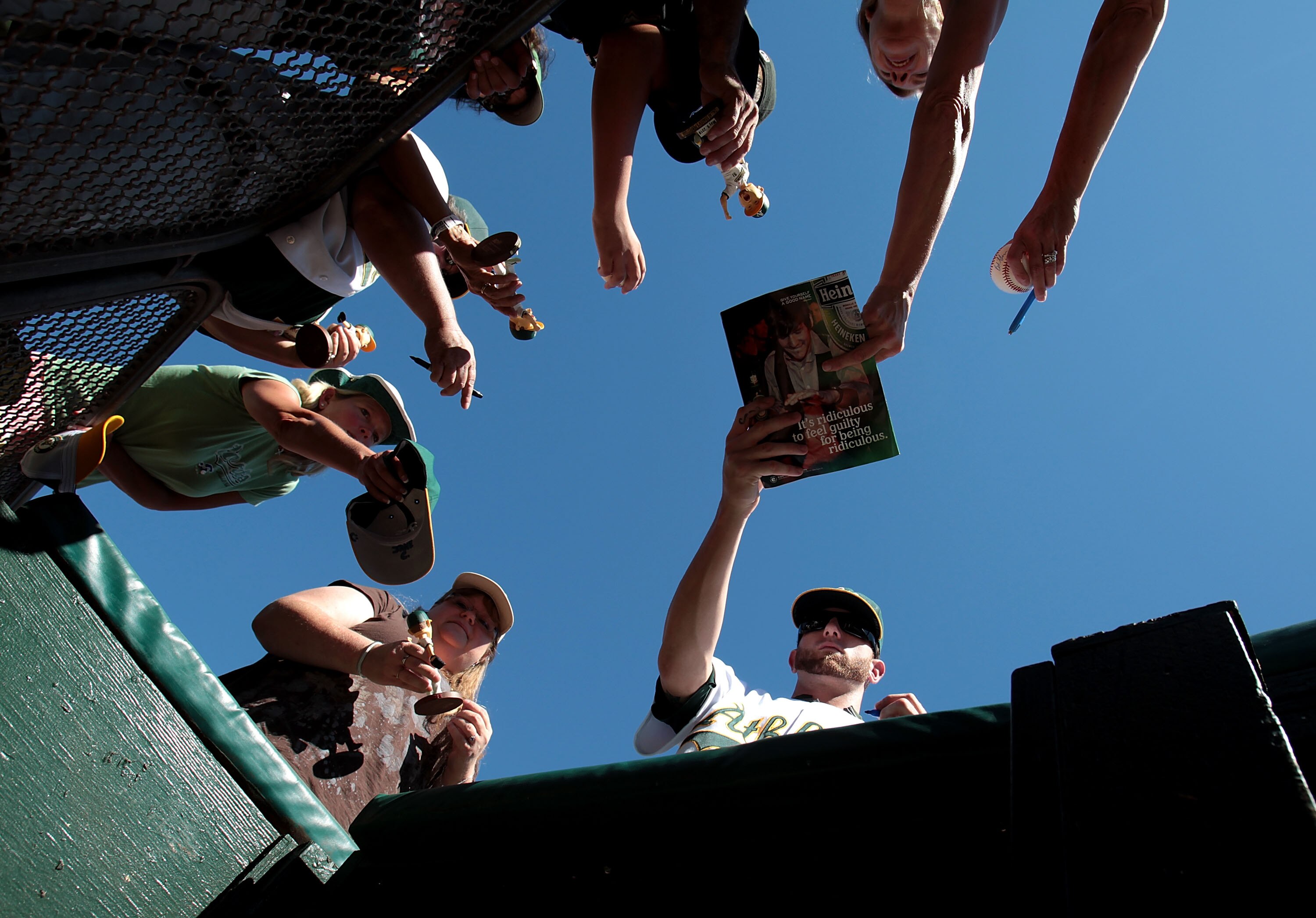 OAKLAND, CA - SEPTEMBER 26:  Dallas Braden #51 of the Oakland Athletics signs autographs before his game against the Texas Rangers during a Major League Baseball game at the Oakland-Alameda County Coliseum on September 26, 2010 in Oakland, California. (Ph
