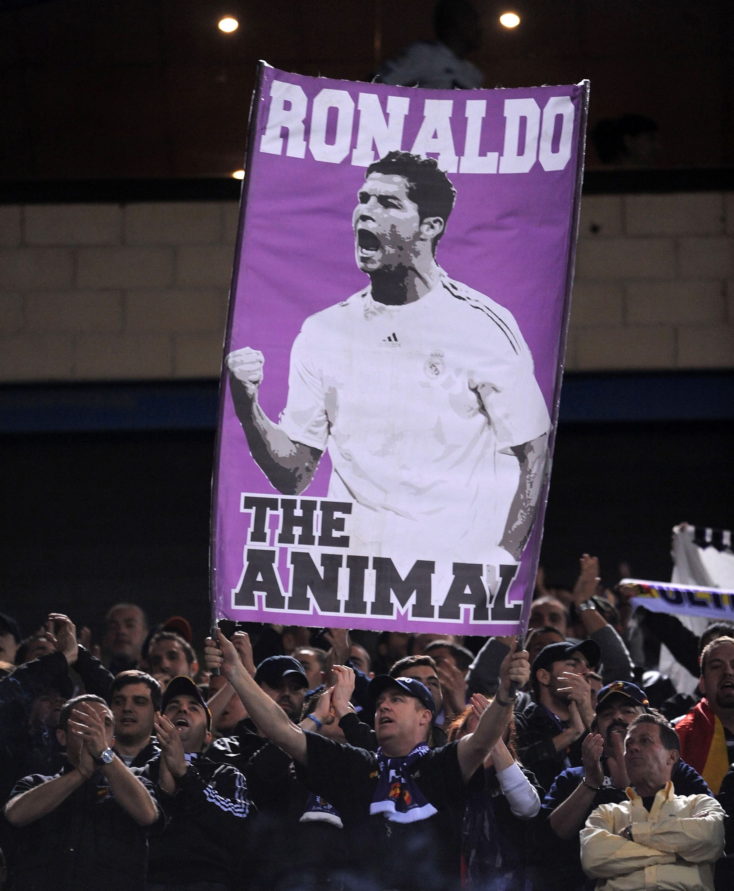 MADRID, SPAIN - MARCH 19:  A Real Madrid fan holds up a banner of Cristiano Ronaldo before the start of the La Liga match between Atletico Madrid and Real Madrid at Vicente Calderon Stadium on March 19, 2011 in Madrid, Spain.  (Photo by Denis Doyle/Getty