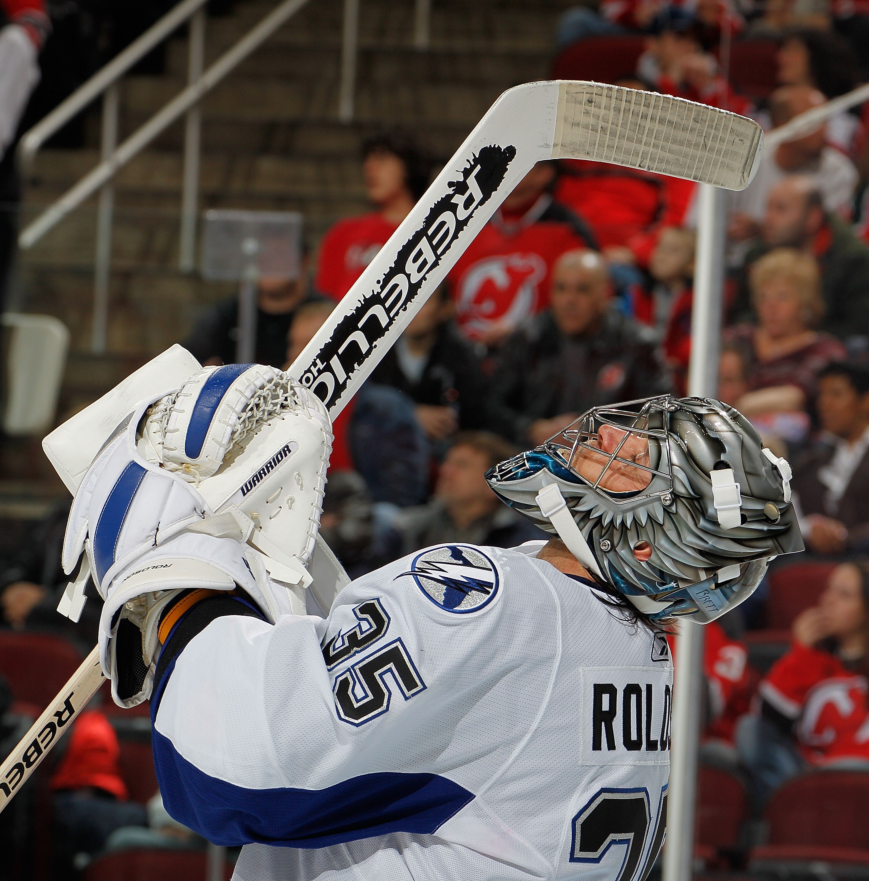NEWARK, NJ - MARCH 02:  Goalie Dwayne Roloson #35 of the Tampa Bay Lightning looks up during a timeout in an NHL hockey game against the New Jersey Devils at the Prudential Center on March 2, 2011 in Newark, New Jersey.  (Photo by Paul Bereswill/Getty Ima