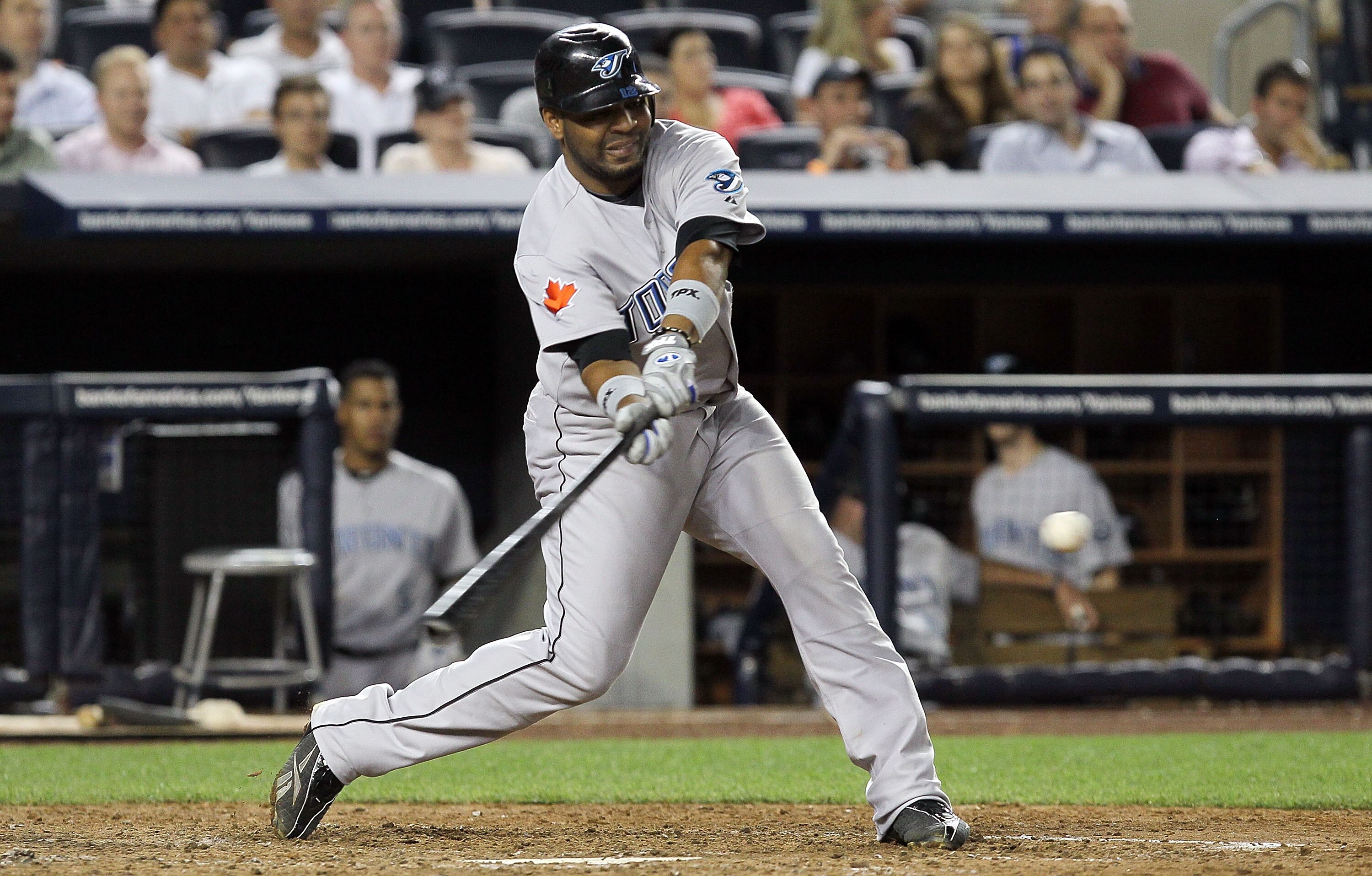 NEW YORK - AUGUST 03:  Edwin Encarnacion #12 of the Toronto Blue Jays in action against of the New York Yankees on August 3, 2010 at Yankee Stadium in the Bronx borough of New York City. The Jays defeated the Yankees 8-2.  (Photo by Jim McIsaac/Getty Imag