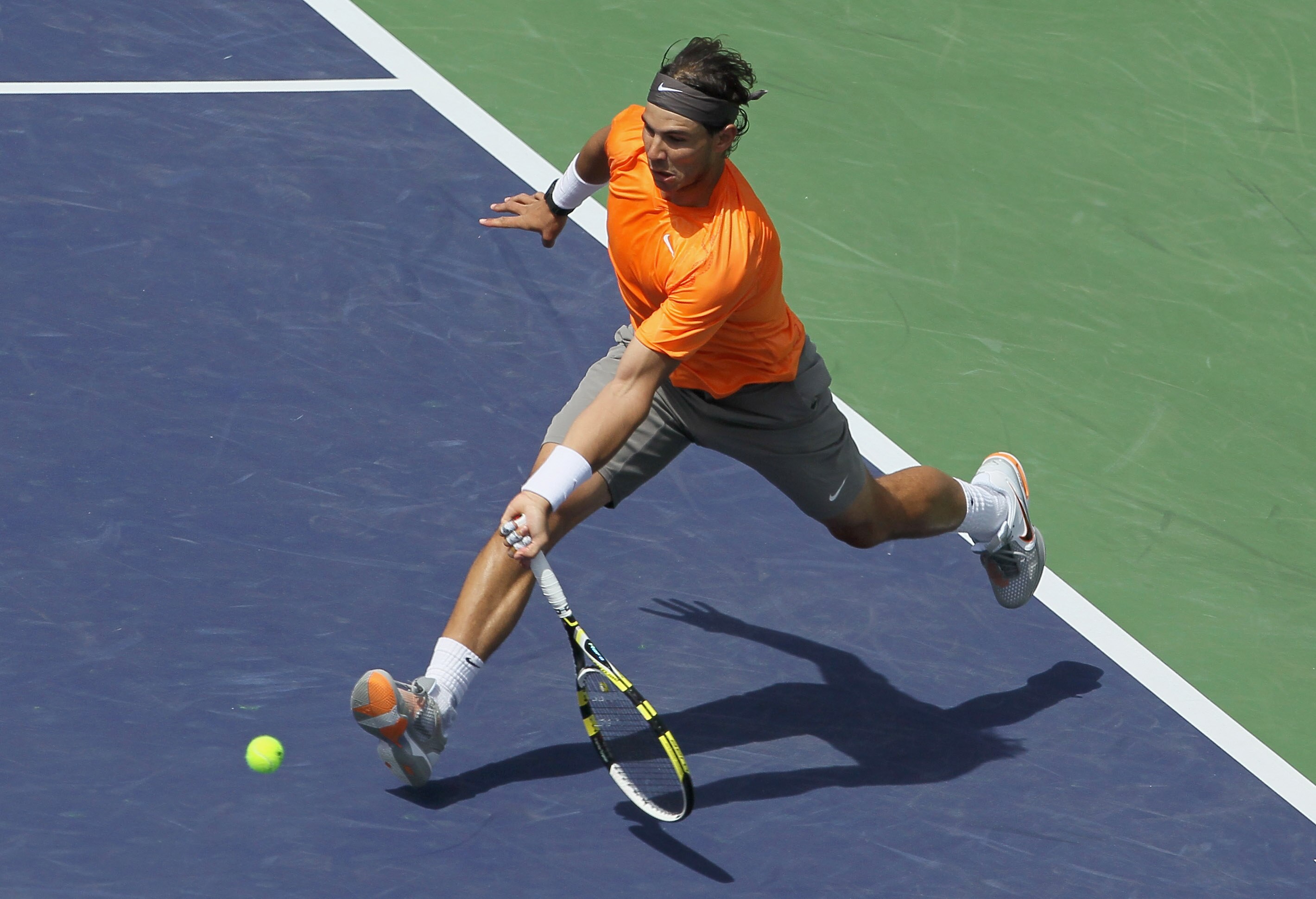 INDIAN WELLS, CA - MARCH 19:  Rafael Nadal of Spain lunges to return a forehand to Juan Martin Del Potro of Argentina during the semifinals of the BNP Paribas Open at the Indian Wells Tennis Garden on March 19, 2011 in Indian Wells, California.  (Photo by