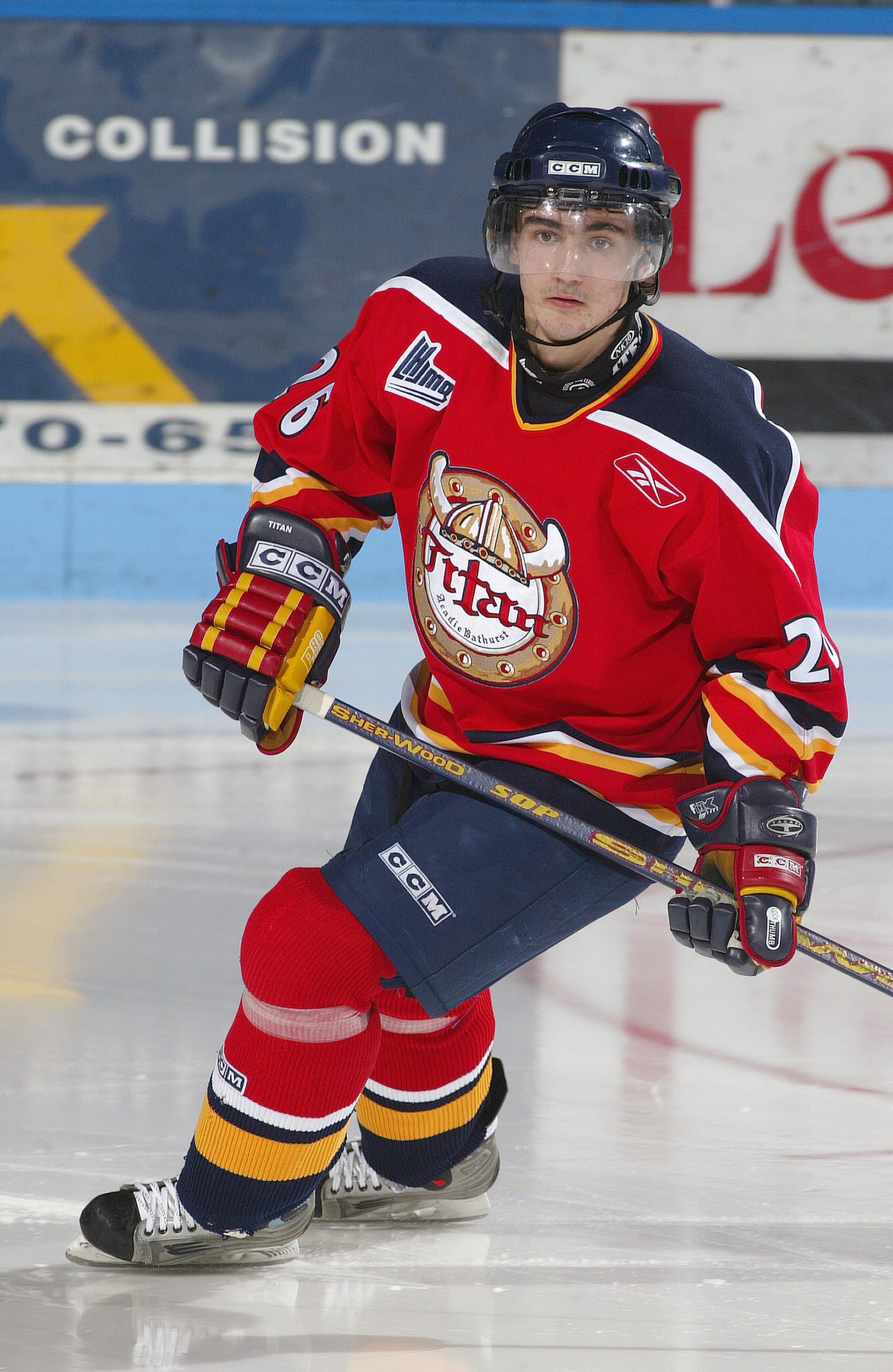 GATINEAU, CANADA - NOVEMBER 24:  Martin Vagner #26 of Acadie-Bathurst Titan skates against Gatineau Olympiques during the Quebec Major Junior Hockey League game at Robert-Guertin Centre on November 24, 2004 in Gatineau, Quebec, Canada. The Olympiques won
