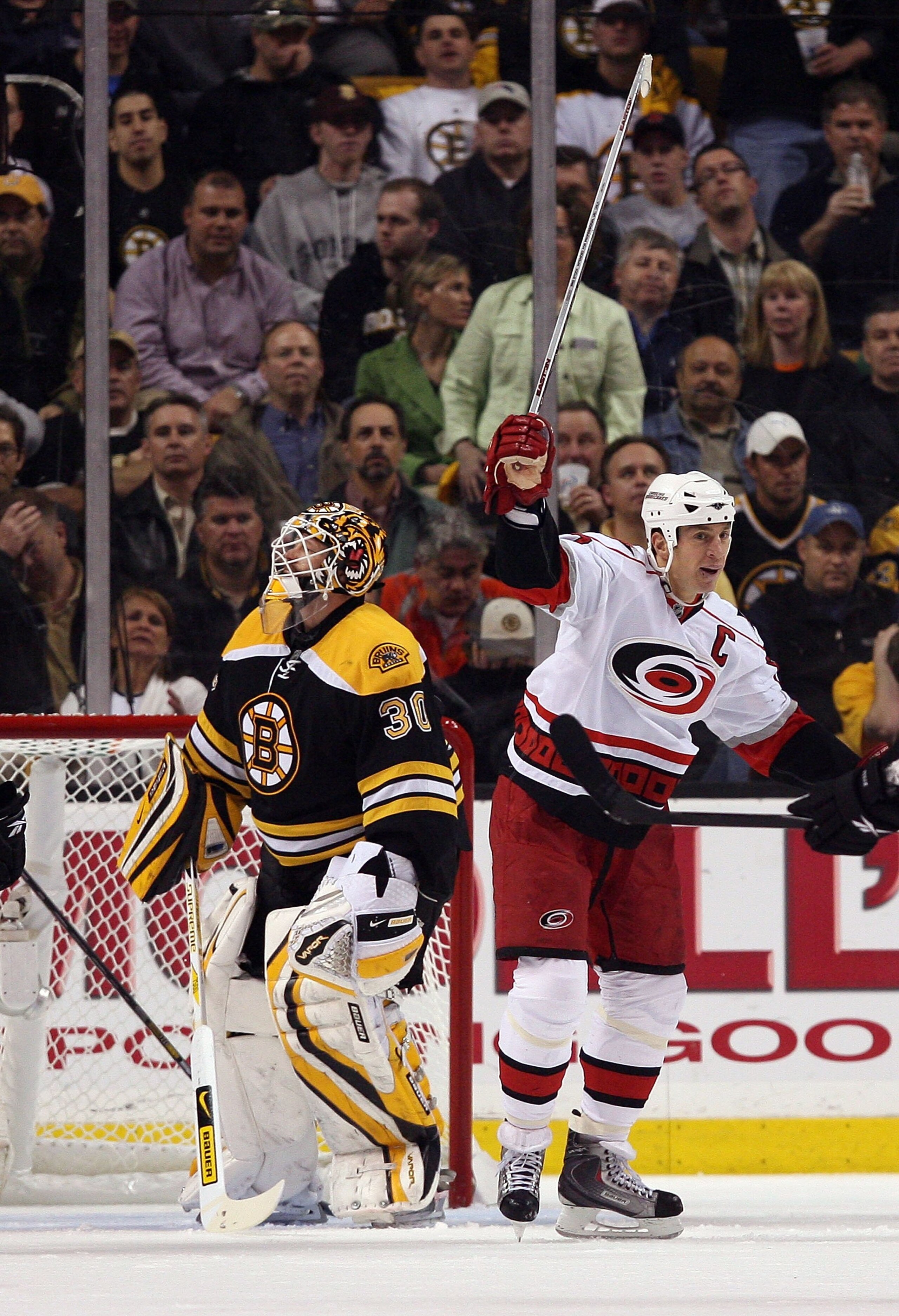 BOSTON - MAY 14:  Rod Brind'Amour #17 of the Carolina Hurricanes celebrates his goal as Tim Thomas #30 of the Boston Bruins looks on during Game Seven of the Eastern Conference Semifinal Round of the 2009 Stanley Cup Playoffs on May 14, 2009 at the TD Ban