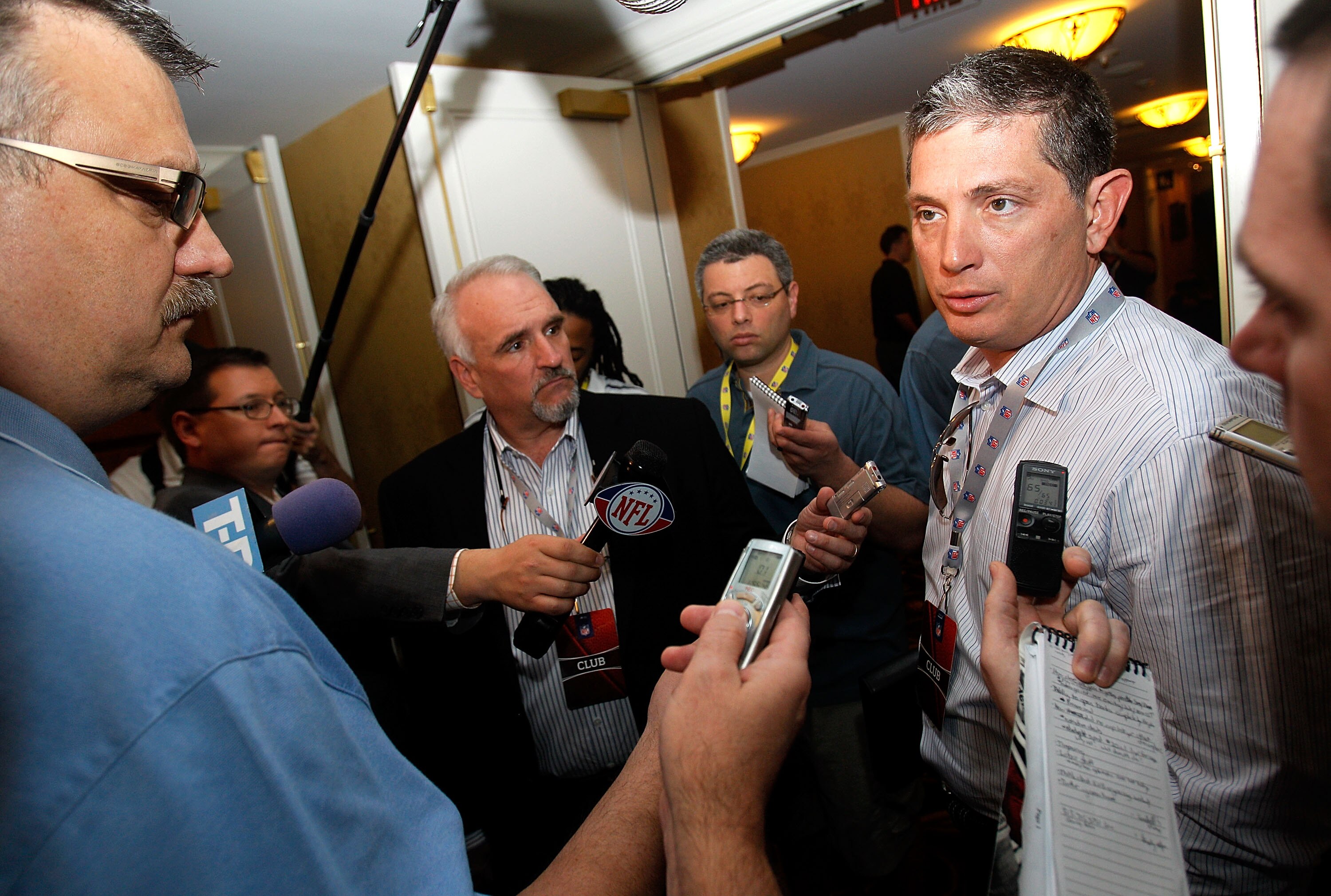 NEW ORLEANS, LA - MARCH 21:  Detroit Lions head coach Jim Schwartz (R) answers questions from the media while attending the NFL Annual Meetings at the Roosevelt Hotel on March 21, 2011 in New Orleans, Louisiana. Despite a NFL owners imposed lockout in eff