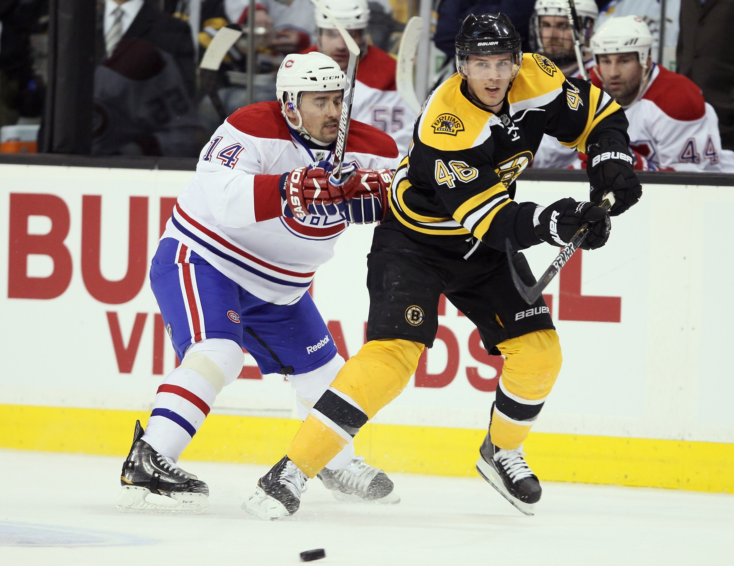 BOSTON, MA - MARCH 24:  David Krejci #46 of the Boston Bruins passes the puck as Tomas Plekanec #14 of the Montreal Canadiens defends on March 24, 2011 at the TD Garden in Boston, Massachusetts.  (Photo by Elsa/Getty Images)