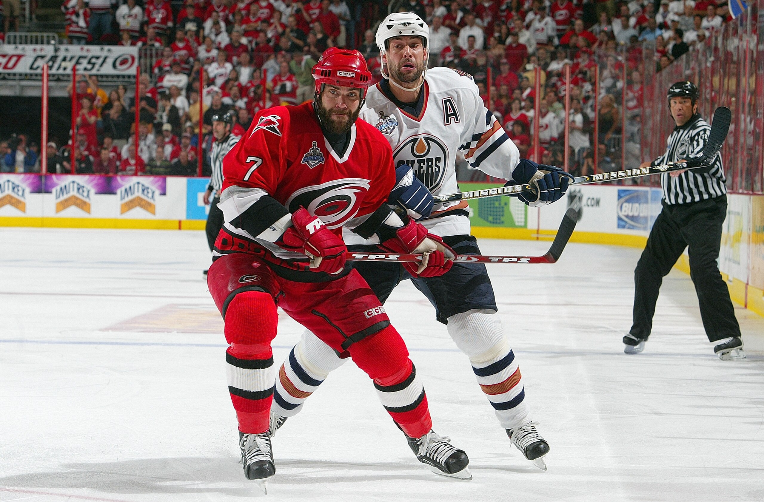RALEIGH, NC - JUNE 19:  Niclas Wallin #7 of the Carolina Hurricanes holds off Ethan Moreau #18 of the Edmonton Oilers during game seven of the 2006 NHL Stanley Cup Finals on June 19, 2006 at the RBC Center in Raleigh, North Carolina. The Hurricanes defeat
