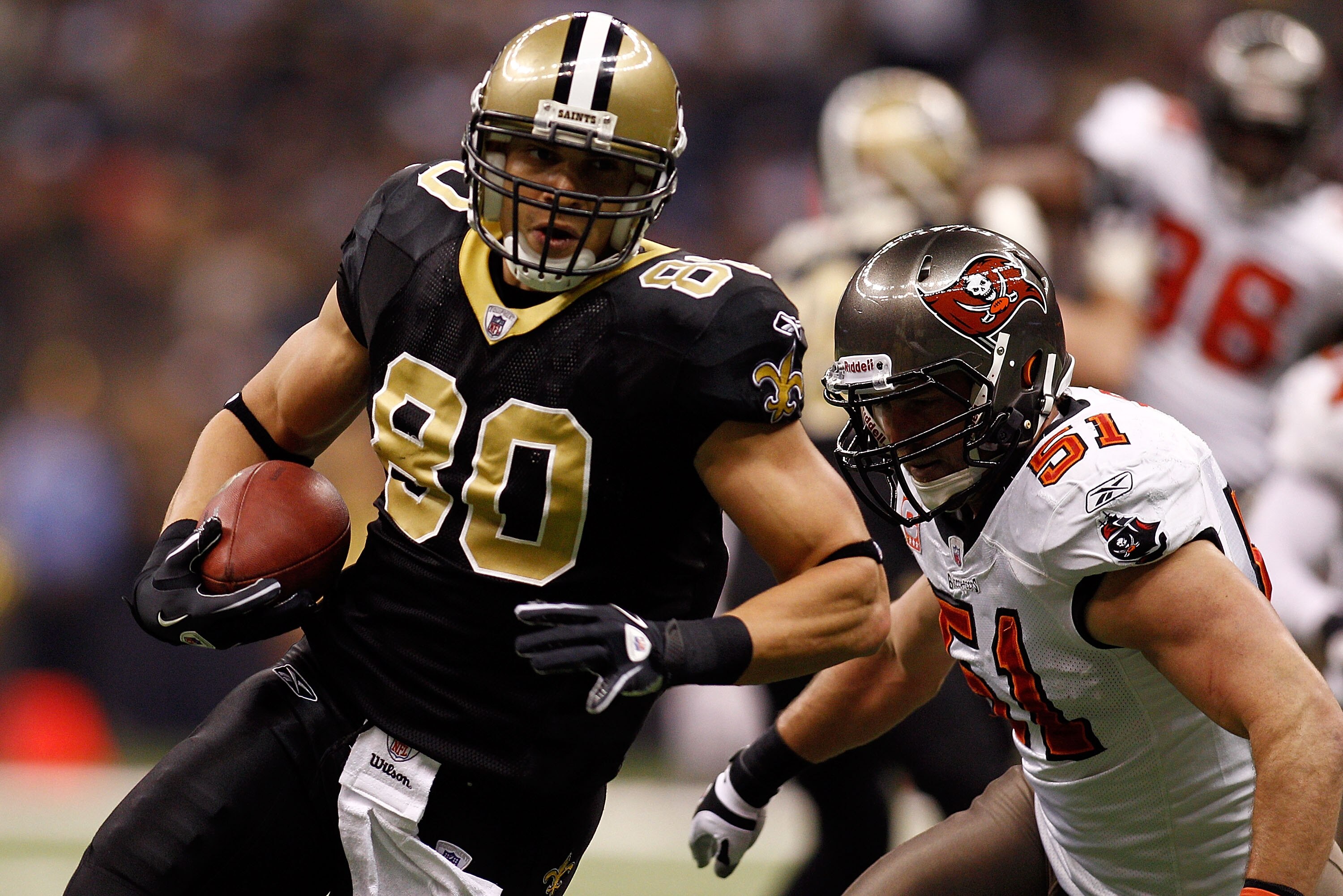 NEW ORLEANS, LA - JANUARY 02:  Jimmy Graham #80 of the New Orleans Saints is tackled by Barrett Ruud #51 of the Tampa Bay Buccaneers at the Louisiana Superdome on January 2, 2011 in New Orleans, Louisiana.  (Photo by Chris Graythen/Getty Images)