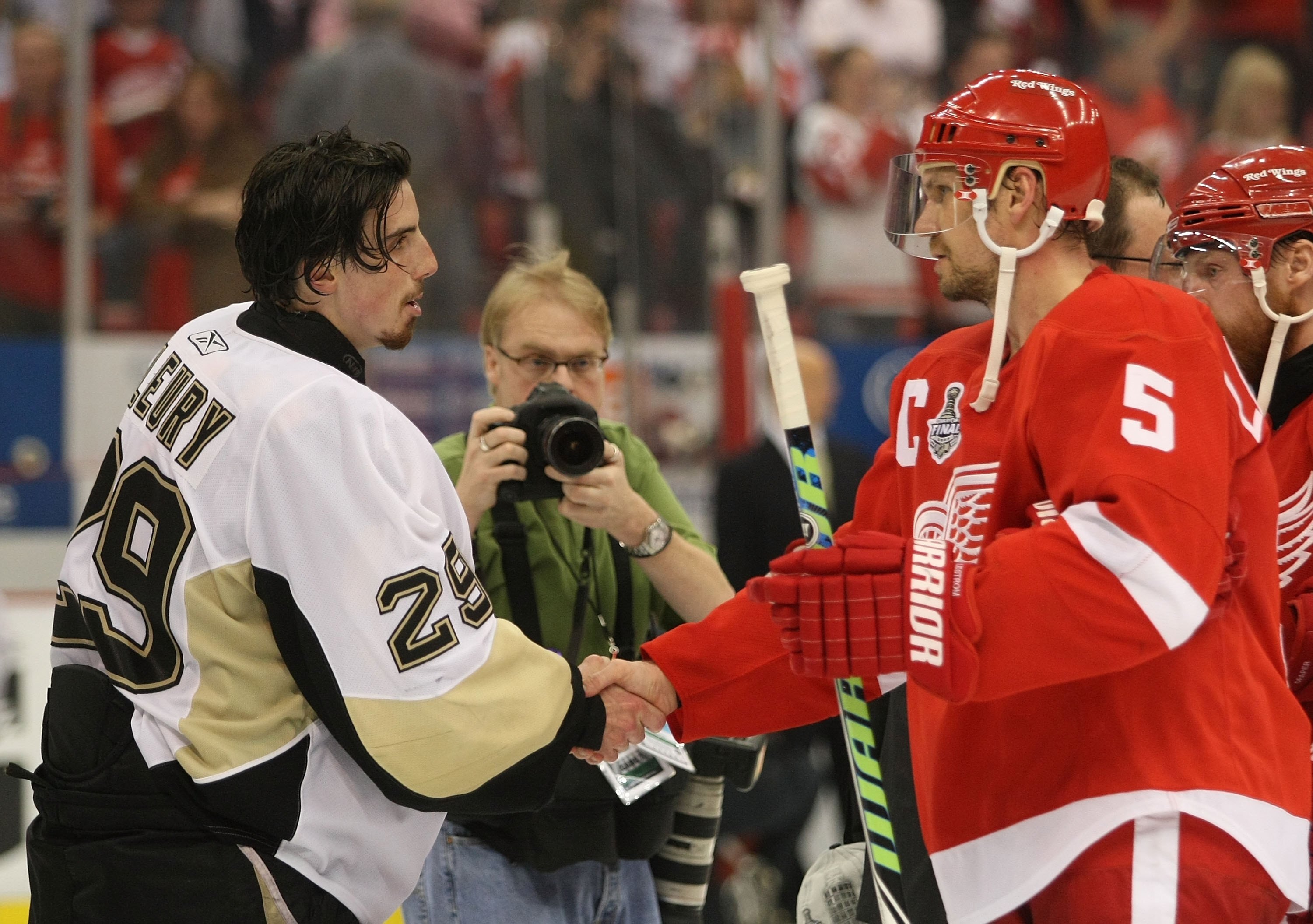 DETROIT - JUNE 12: Marc-Andre Fleury #29 of the Pittsburgh Penguins and Nicklas Lidstrom #5 of the Detroit Red Wings shake hands following Game Seven of the 2009 NHL Stanley Cup Finals at Joe Louis Arena on June 12, 2009 in Detroit, Michigan. (Photo by Br