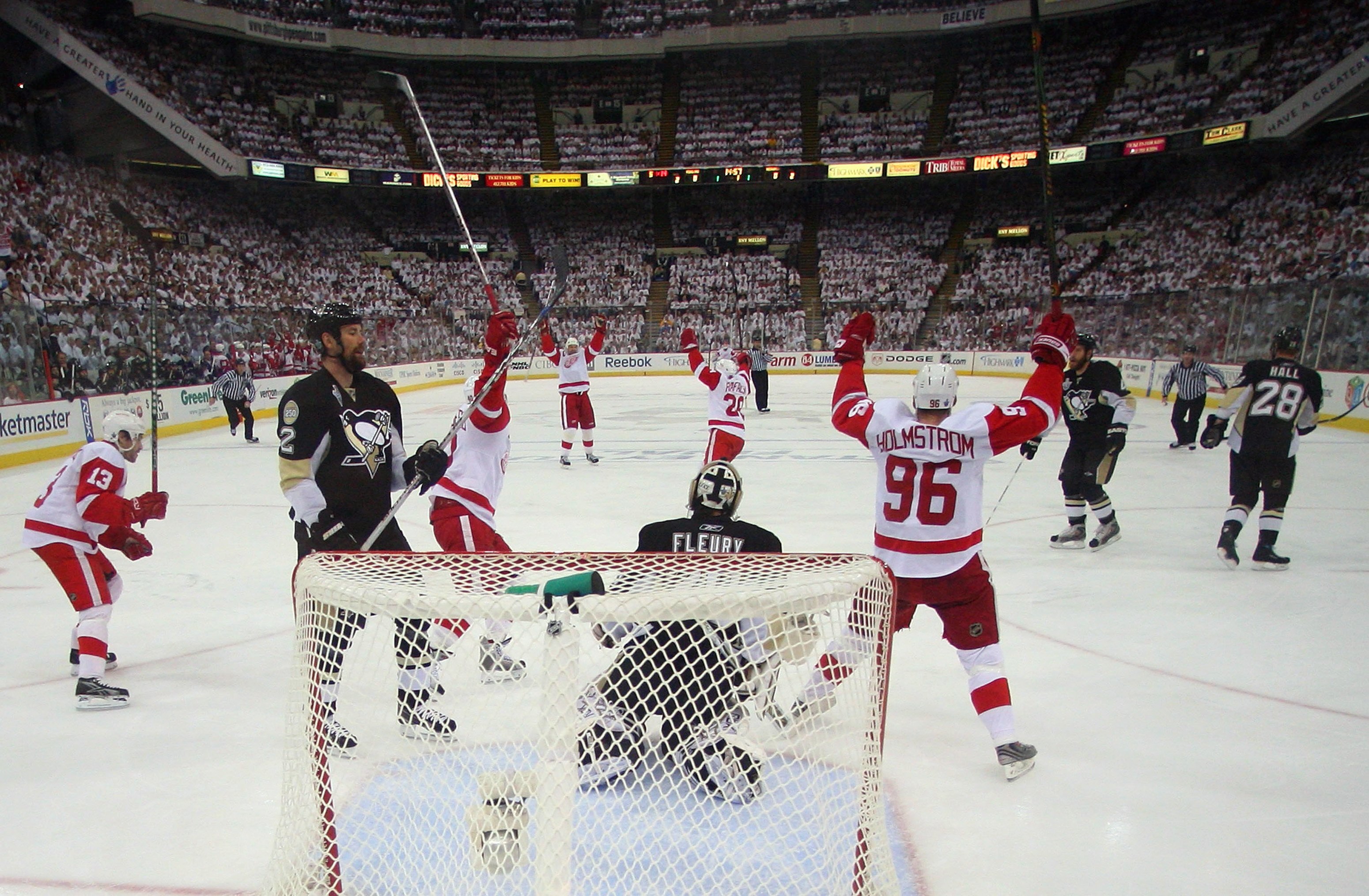 DETROIT - JUNE 4:  The Detroit Red Wings celebrate a goal as Hal Gill #2 of the Pittsburgh Penguins looks on during game six of the 2008 NHL Stanley Cup Finals at Mellon Arena on June 4, 2008 in Pittsburgh. Pennsylvania. (Photo by Bruce Bennett/Getty Imag