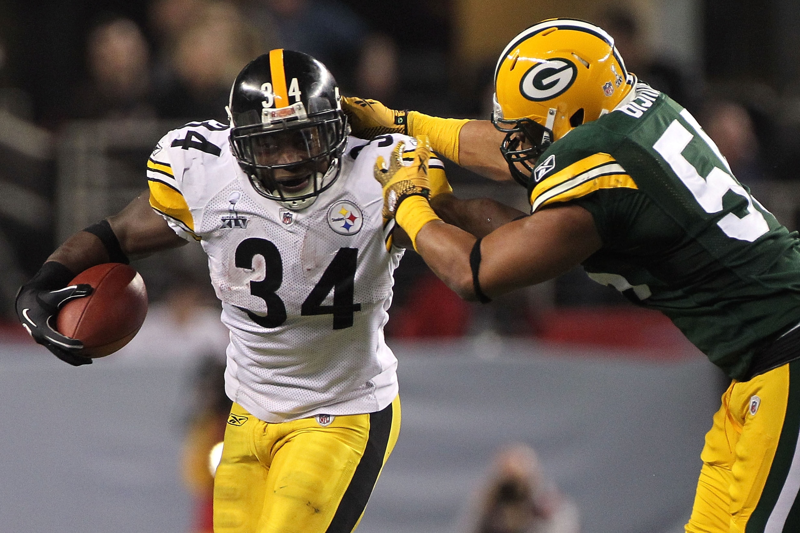 ARLINGTON, TX - FEBRUARY 06:  Rashard Mendenhall #34 of the Pittsburgh Steelers runs the ball against Desmond Bishop #55 of the Green Bay Packers during Super Bowl XLV at Cowboys Stadium on February 6, 2011 in Arlington, Texas.  (Photo by Doug Pensinger/G