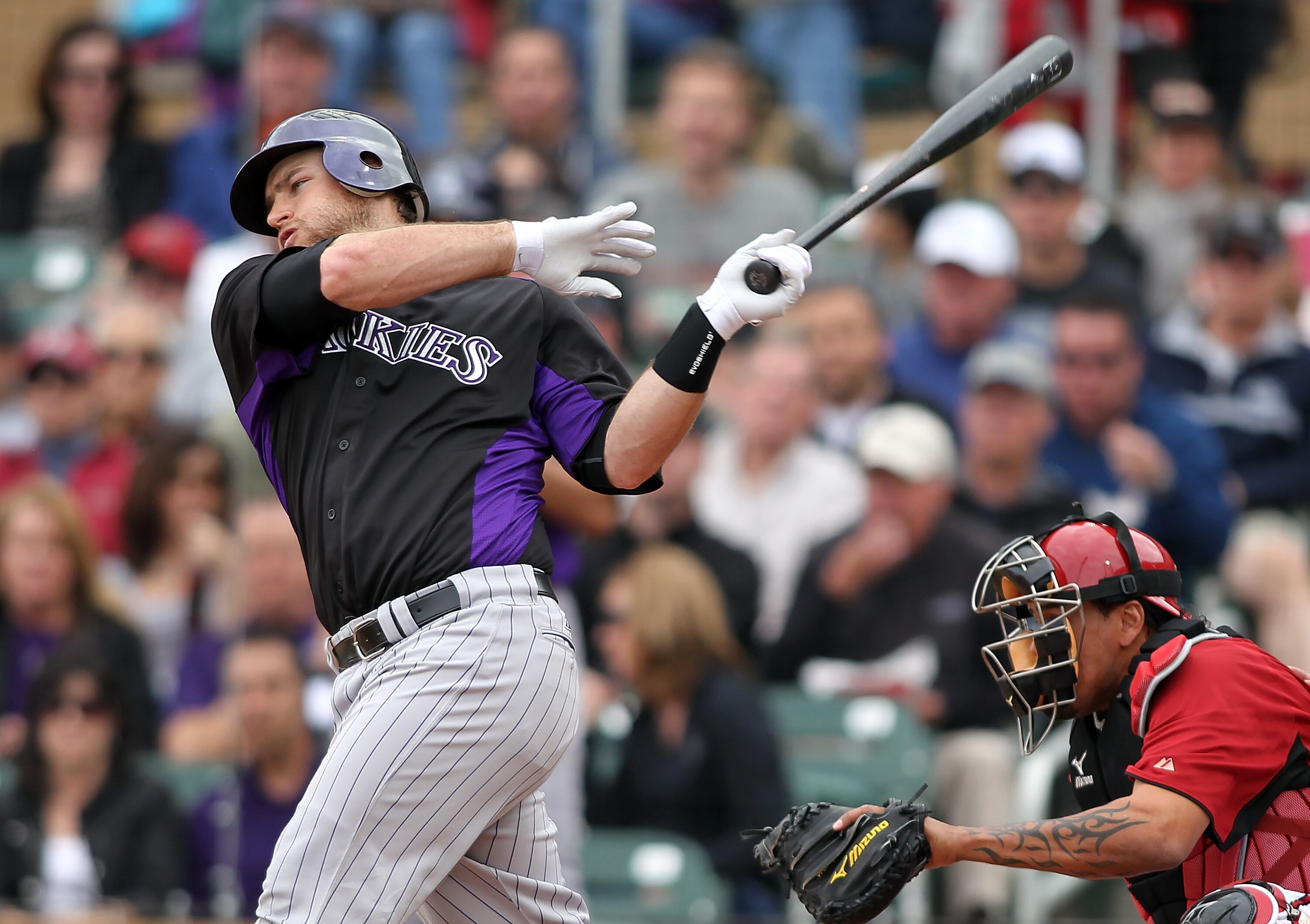SCOTTSDALE, AZ - FEBRUARY 26:  Chris Iannetta #20 of the Colorado Rockies swings against the game against the Arizona Diamondbacks at Salt River Fields on February 26, 2011in Scottsdale, Arizona..  (Photo by Jonathan Ferrey/Getty Images)