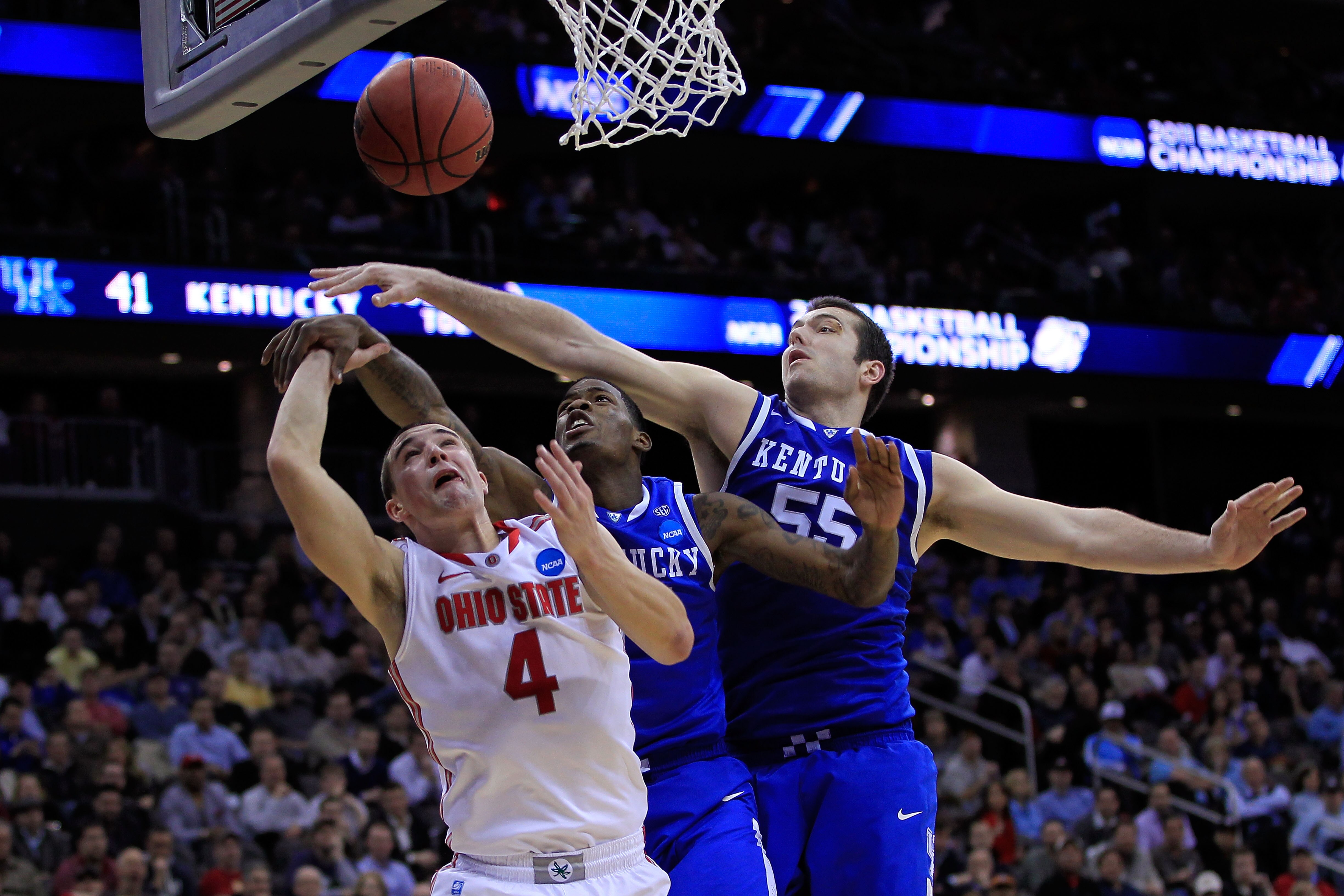 NEWARK, NJ - MARCH 25:  Josh Harrellson #55 of the Kentucky Wildcats blocks a shot of Aaron Craft #4 of the Ohio State Buckeyes during the east regional semifinal of the 2011 NCAA Men's Basketball Tournament at the Prudential Center on March 25, 2011 in N