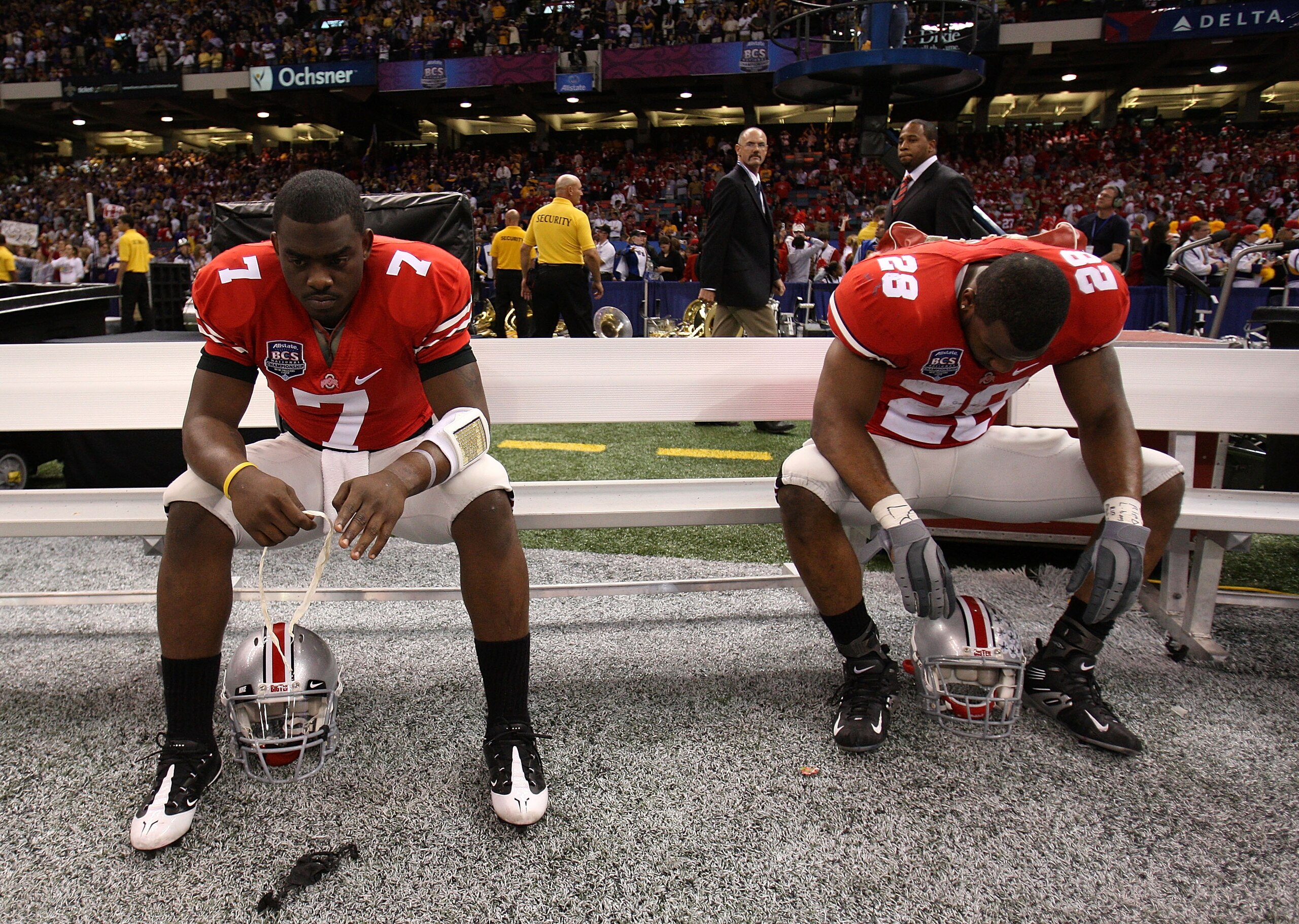 NEW ORLEANS - JANUARY 07:  Antonio Henton #7 and Chris Wells #28 of the Ohio State Buckeyes sit dejected after losing 38-24 to the Louisiana State University Tigers during the AllState BCS National Championship on January 7, 2008 at the Louisiana Superdom