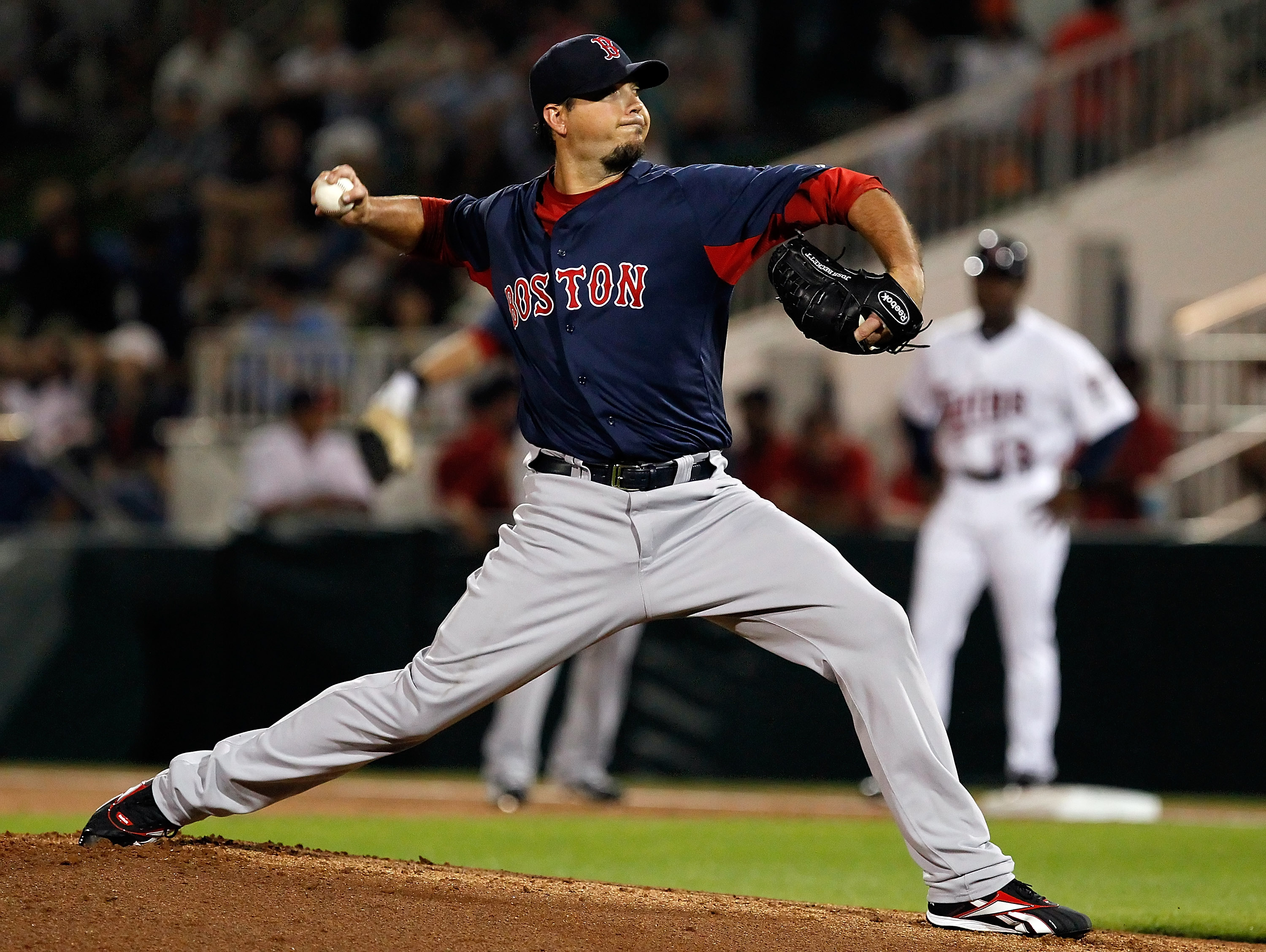 FORT MYERS, FL - FEBRUARY 27:  Pitcher Josh Beckett #19 of the Boston Red Sox pitches against the Minnesota Twins during a Grapefruit League Spring Training Game at Hammond Stadium on February 27, 2011 in Fort Myers, Florida.  (Photo by J. Meric/Getty Ima