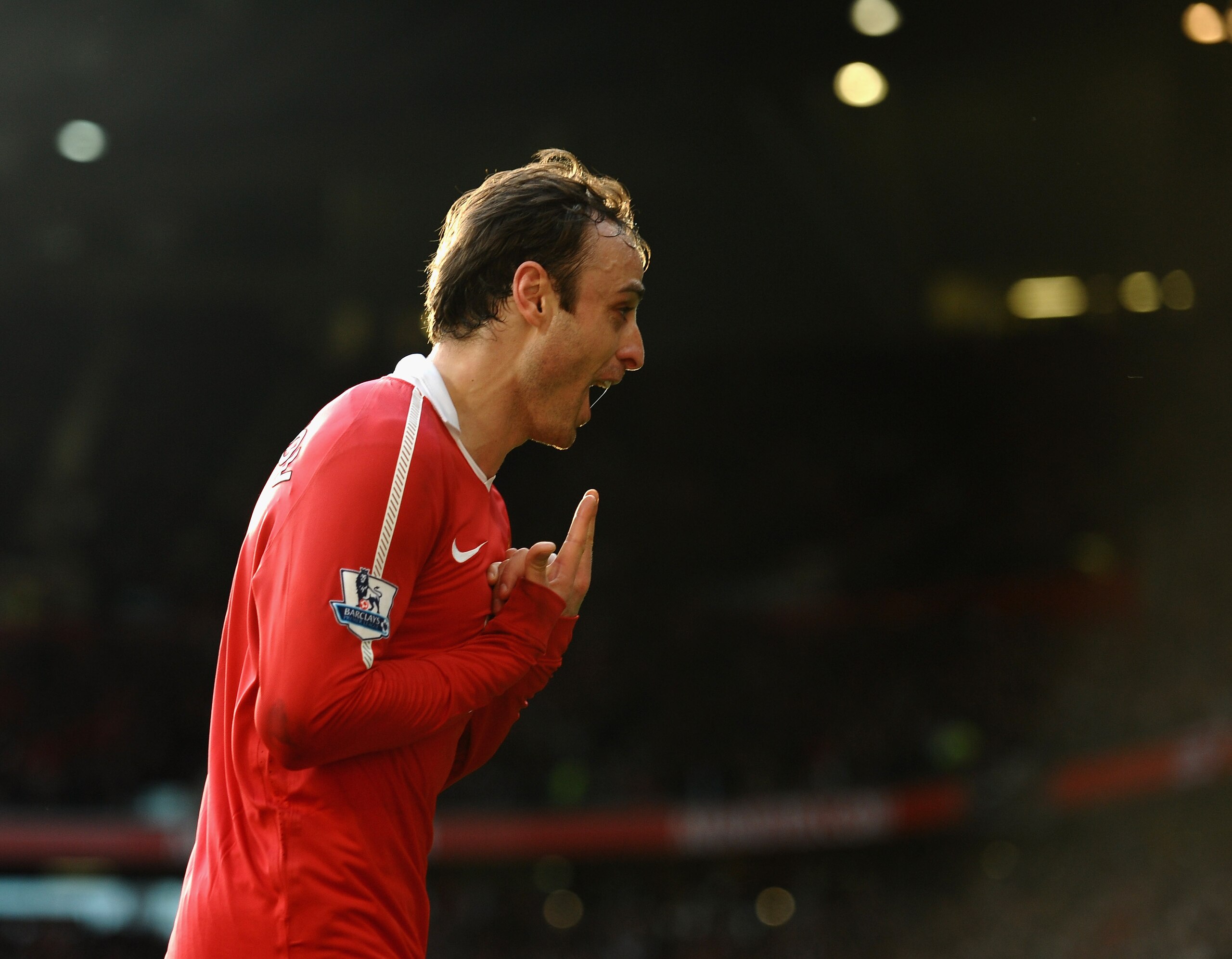 MANCHESTER, ENGLAND - MARCH 19:  Dimatar Berbatov of Manchester United celebrates scoring the winning goal during the Barclays Premier League match between Manchester United and Bolton Wanderers at Old Trafford on March 19, 2011 in Manchester, England.  (