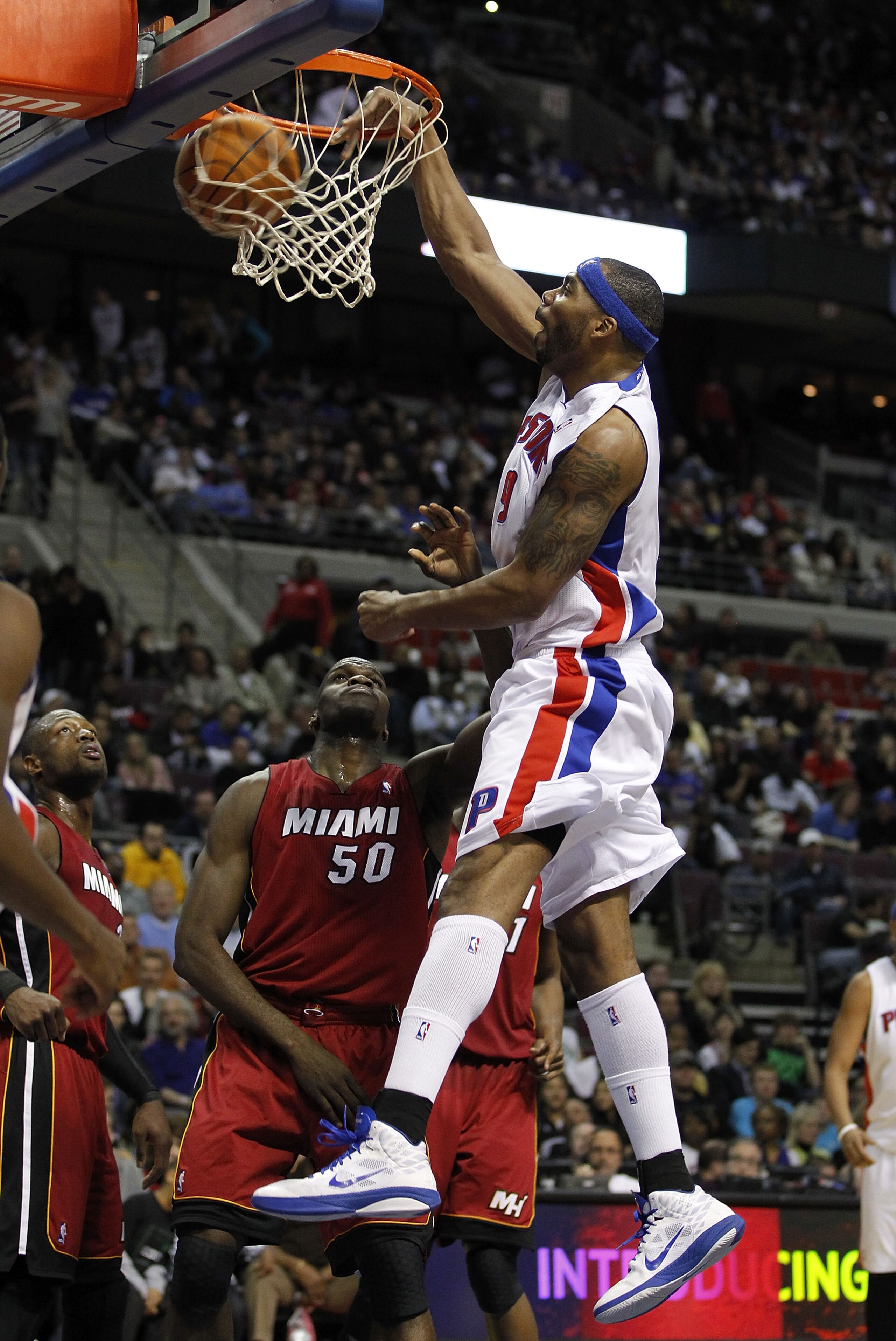 AUBURN HILLS, MI - FEBRUARY 11:  Chris Wilcox #9 of the Detroit Pistons gets in for a dunk over Joel Anthony #50 of the Miami Heat at The Palace of Auburn Hills on February 11, 2011 in Auburn Hills, Michigan. Miami won the game 106-92. NOTE TO USER: User