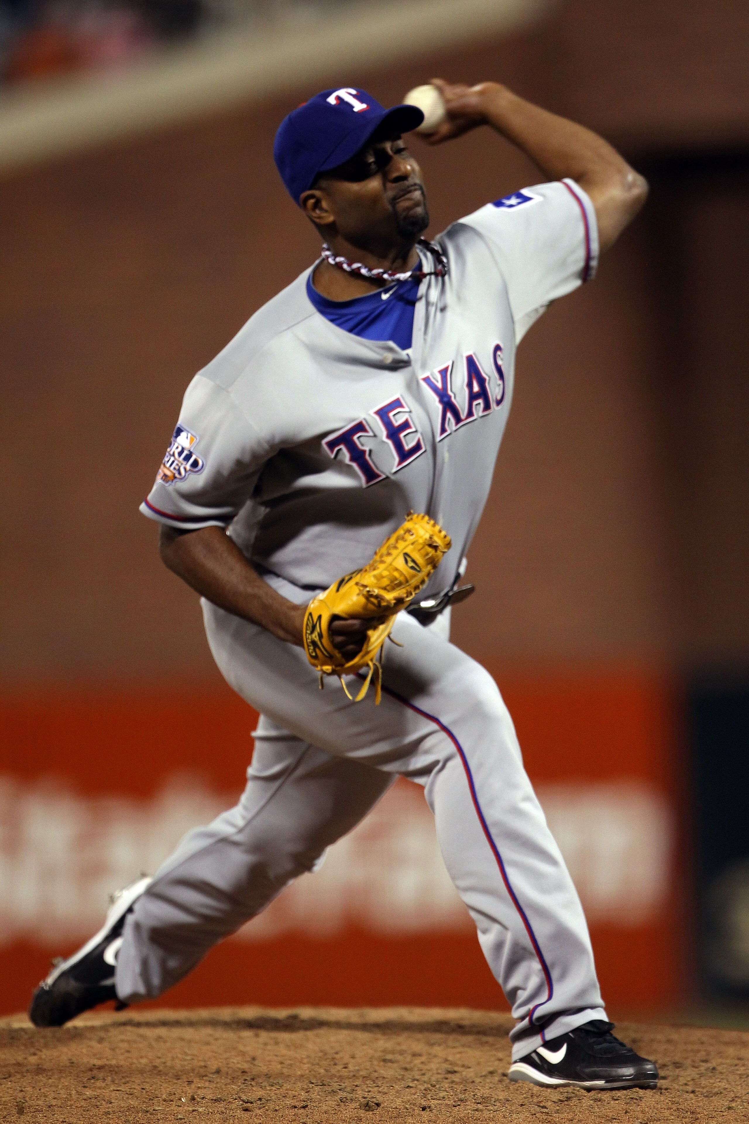 SAN FRANCISCO - OCTOBER 28:  Darren Oliver #28 of the Texas Rangers pitches in the seventh inning while taking on the San Francisco Giants in Game Two of the 2010 MLB World Series at AT&T Park on October 28, 2010 in San Francisco, California.  (Photo by D