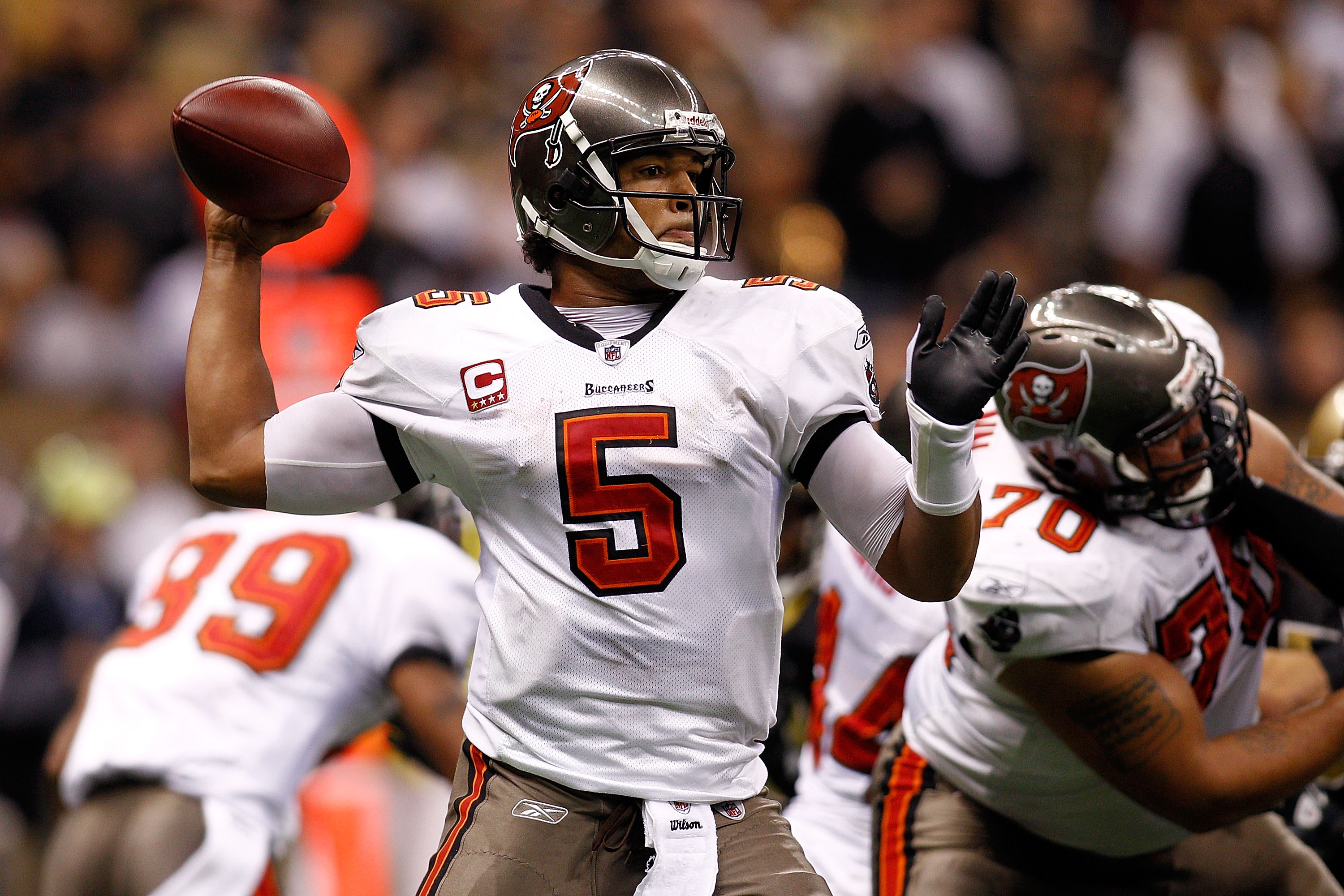 NEW ORLEANS, LA - JANUARY 02:  Quarterback Josh Freeman #5  of the Tampa Bay Buccaneers throws the ball during the game against the New Orleans Saints at the Louisiana Superdome on January 2, 2011 in New Orleans, Louisiana.  (Photo by Chris Graythen/Getty