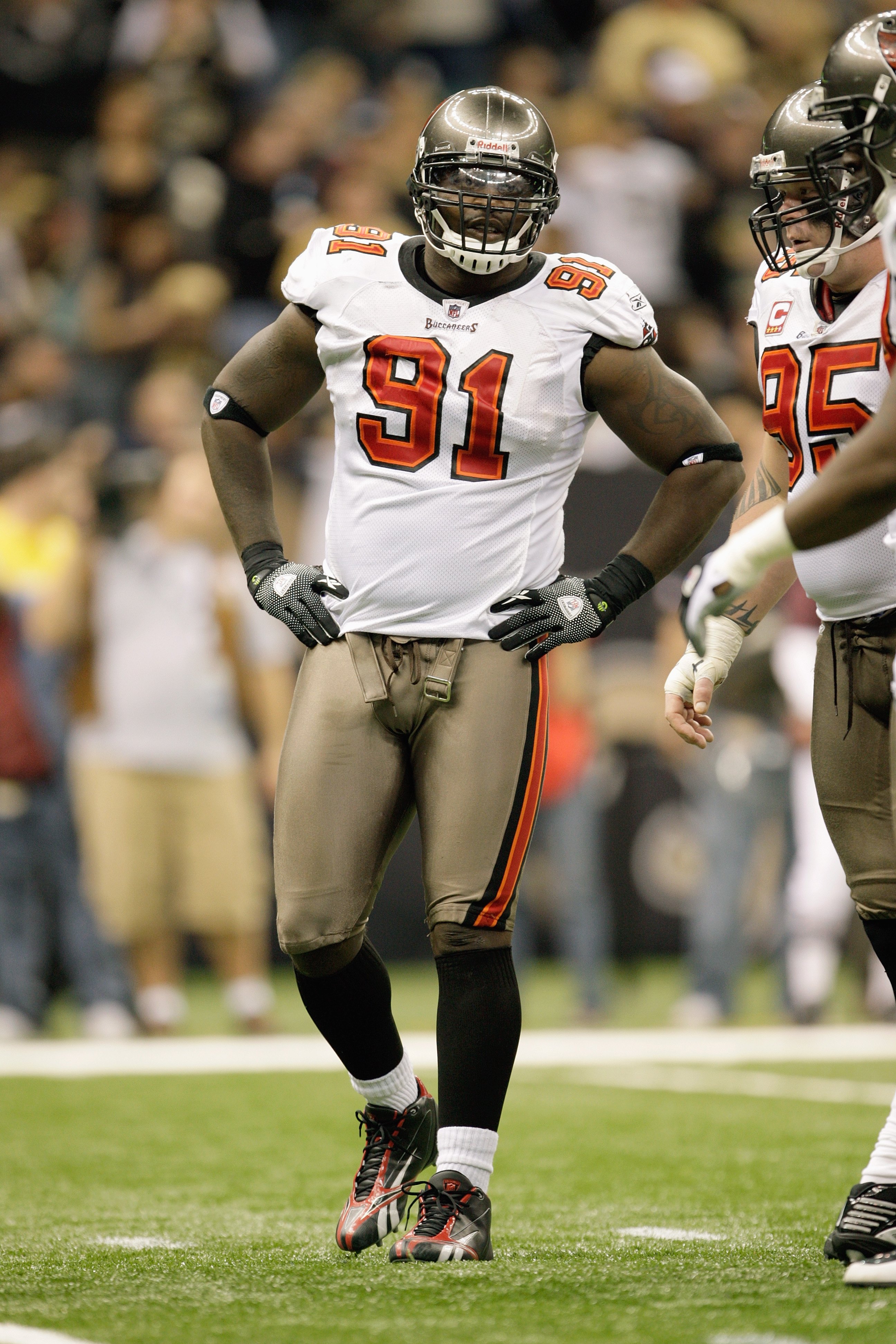 NEW ORLEANS - DECEMBER 27:  Stylez G White #91 of the Tampa Bay Buccaneers walks on the field during the game against the New Orleans Saints at the Louisiana Superdome on December 27, 2009 in New Orleans, Louisiana. (Photo by Jamie Squire/Getty Images)