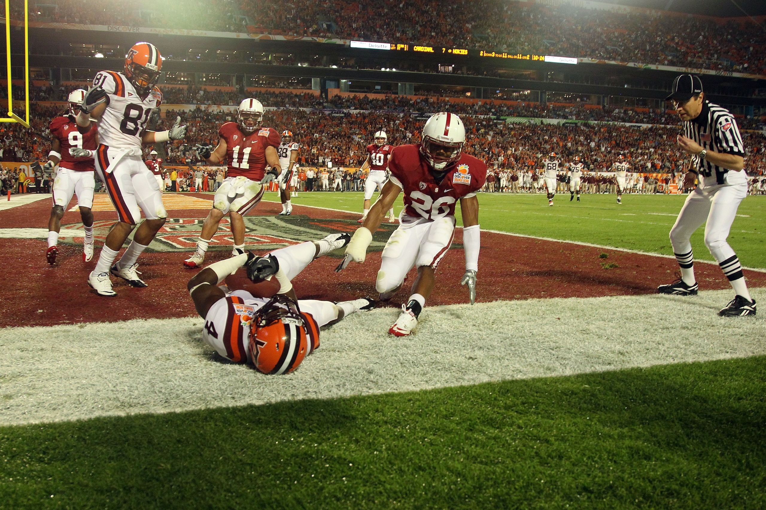 MIAMI, FL - JANUARY 03:  David Wilson #4 of the Virginai Tech Hokies scores an 11-yard touchdown reception in the second quarter againstDElano Howell #26 of the Stanford Cardinal during the 2011 Discover Orange Bowl at Sun Life Stadium on January 3, 2011