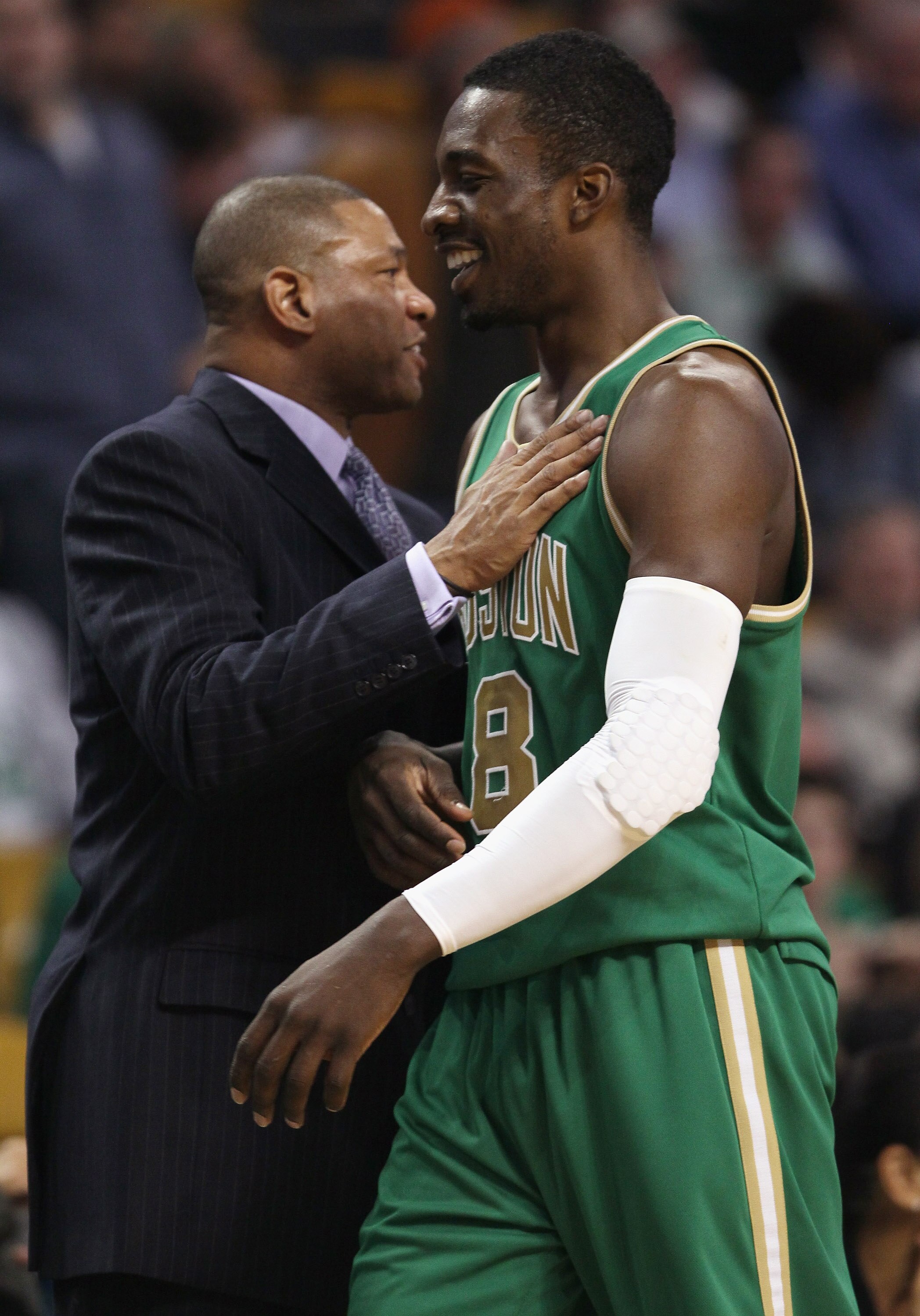 BOSTON, MA - MARCH 16:  Jeff Green #8 is congratulated by Doc Rivers of the Boston Celtics as Green is pulled from the game on March 16, 2011 at the TD Garden in Boston, Massachusetts. The Celtics defeated the Indiana Pacers 92-80. NOTE TO USER: User expr