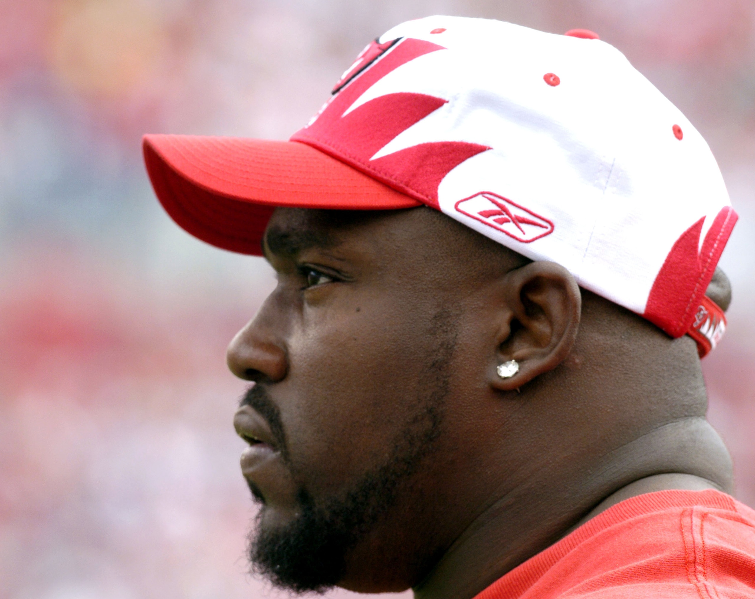 Tampa Bay Buccaneers defensive tackle Warren Sapp, who is injured, watches play  against the Houston Texans at Raymond James Stadium, Tampa, Florida, December 14, 2003.  The Bucs defeated the Texans 16-0.  (Photo by Al Messerschmidt/Getty Images)