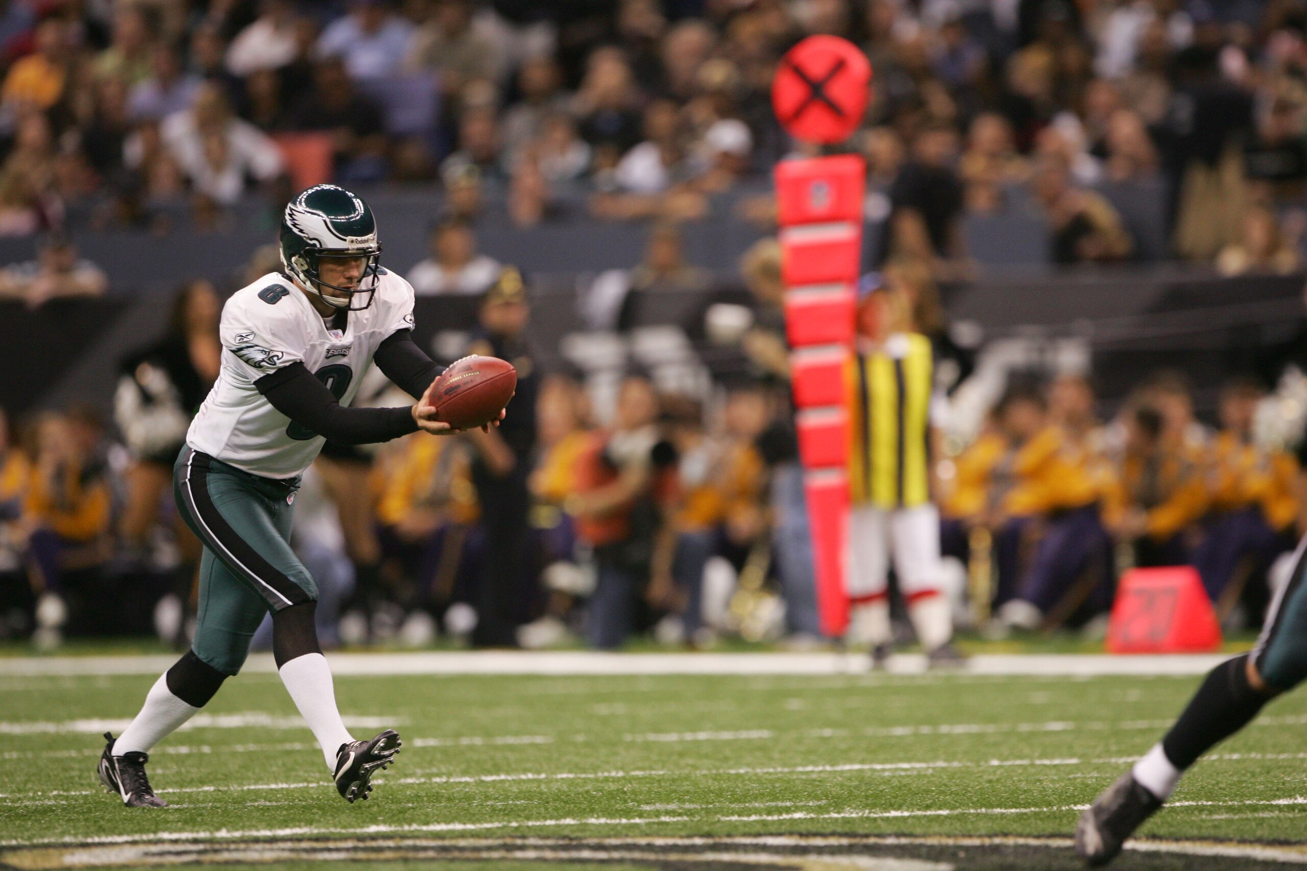 NEW ORLEANS - OCTOBER 15:  Punter Dirk Johnson #8 of the Philadelphia Eagles kicks the ball during the game against the New Orleans Saints at the Louisiana Superdome on October 15, 2006 in New Orleans, Louisiana.  The Saints won 27-24. (Photo by Doug Pens