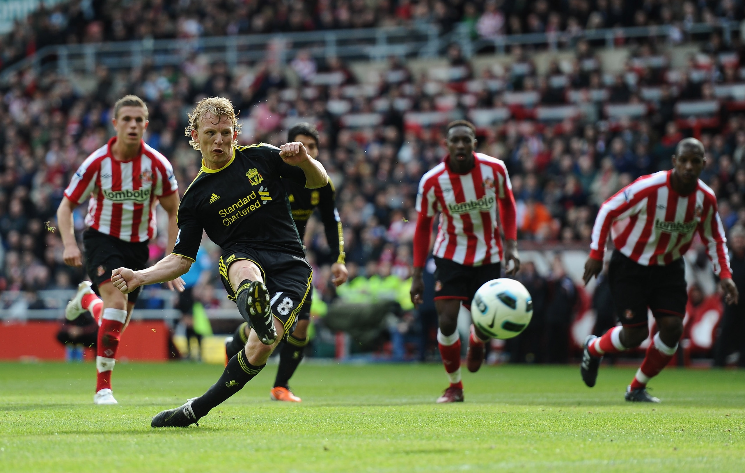 SUNDERLAND, ENGLAND - MARCH 20:  Dirk Kuyt of Liverpool fires home the first goal from the penalty spot during the Barclays Premier League match between Sunderland and Liverpool at the Stadium of Light on March 20, 2011 in Sunderland, England.  (Photo by
