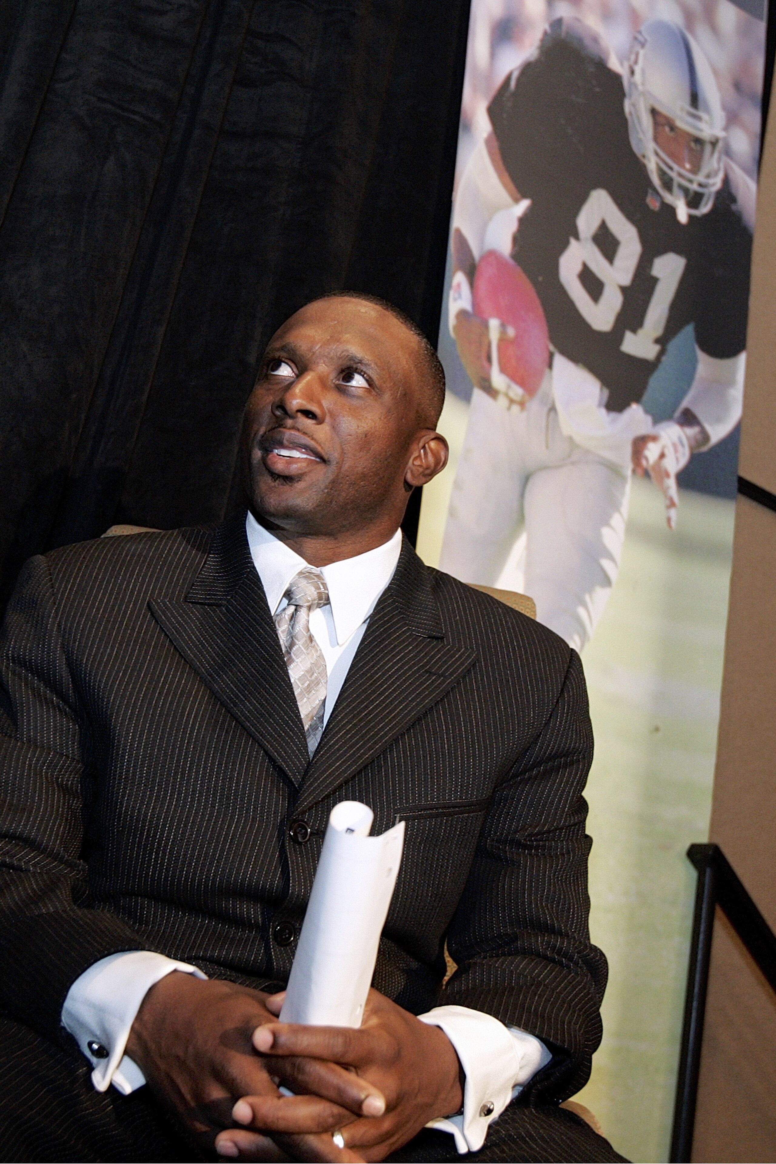 OAKLAND, CA - JULY 18:  Tim Brown announces his retirement from professional football after signing a one day contract with the Oakland Raiders, whom he played most of his career with, during a press conference at the Grand Ballroom of the Oakland Airport