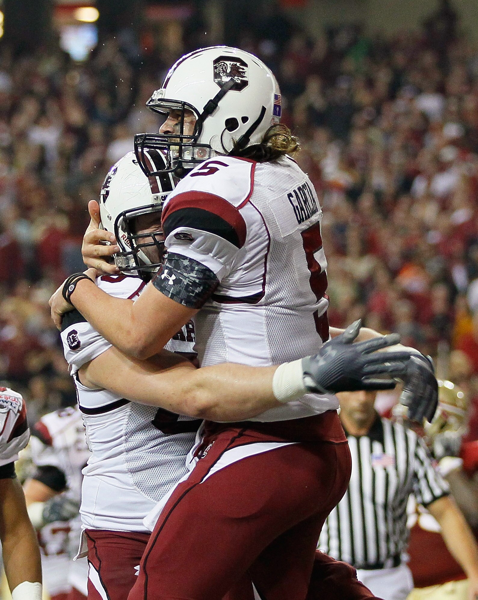 ATLANTA, GA - DECEMBER 31: Quarterback Stephen Garcia #5 of the South Carolina Gamecocks reacts after scoring a touchdown against the Florida State Seminoles with Hutch Eckerson #66 during the 2010 Chick-fil-A Bowl at Georgia Dome on December 31, 2010 in ATLANTA, GA - DECEMBER 31: Quarterback Stephen Garcia #5 of the South Carolina Gamecocks reacts after scoring a touchdown against the Florida State Seminoles with Hutch Eckerson #66 during the 2010 Chick-fil-A Bowl at Georgia Dome on December 31, 2010 in