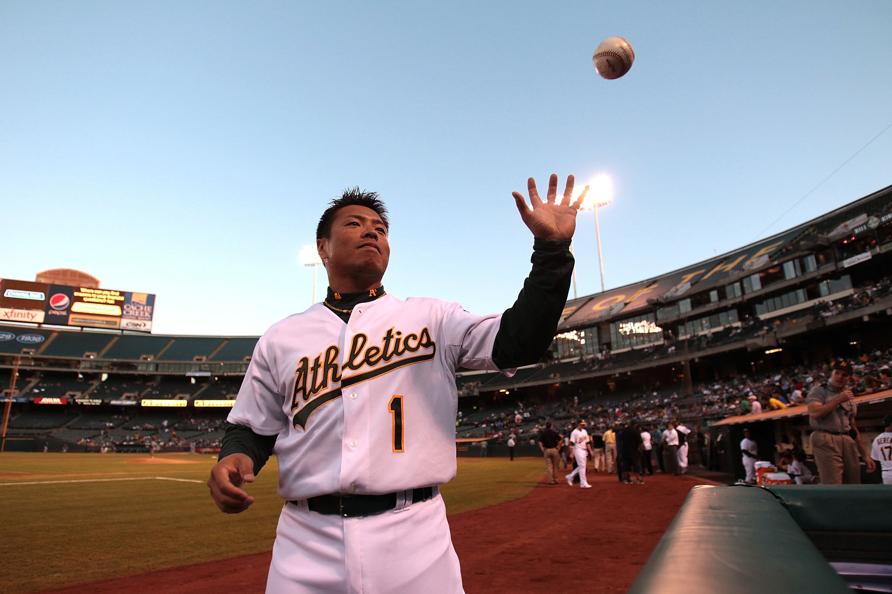 OAKLAND, CA - SEPTEMBER 24:  Aki Iwamura #1 of the Oakland Athletics signs autographs before his game against the Texas Rangers during a Major League Baseball game at the Oakland-Alameda County Coliseum on September 24, 2010 in Oakland, California.  (Phot