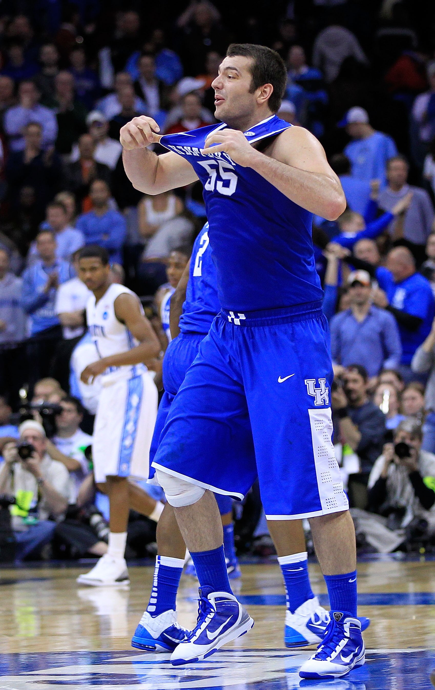 NEWARK, NJ - MARCH 27:  Josh Harrellson #55 of the Kentucky Wildcats celebrates defeating the North Carolina Tar Heels in the east regional final of the 2011 NCAA men's basketball tournament at Prudential Center on March 27, 2011 in Newark, New Jersey.  (