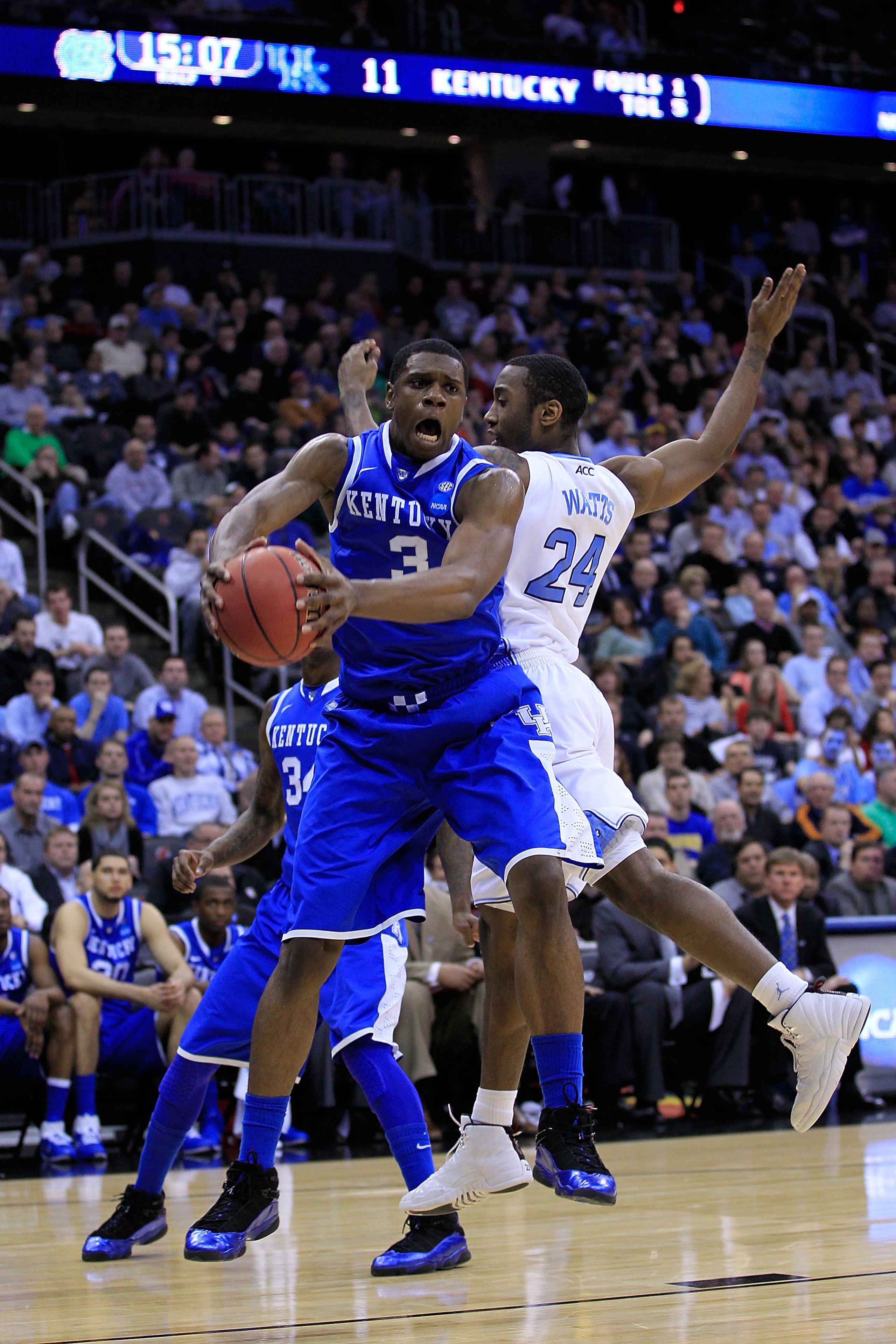 NEWARK, NJ - MARCH 27:  Terrence Jones #3 of the Kentucky Wildcats catches the ball against Justin Watts #24 of the North Carolina Tar Heels during the first half of the east regional final of the 2011 NCAA men's basketball tournament at Prudential Center