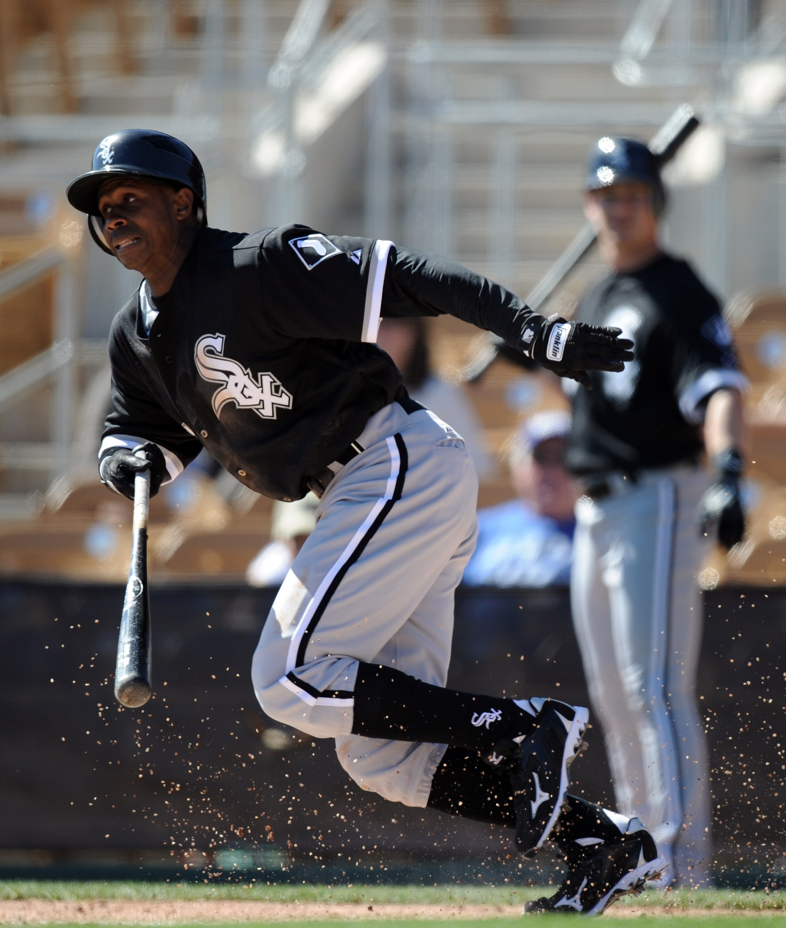 PHOENIX, AZ - FEBRUARY 28:  Juan Pierre #1 of the Chicago White Sox bunts for a single against the Los Angeles Dodgers during spring training at Camelback Ranch on February 28, 2011 in Phoenix, Arizona.  (Photo by Harry How/Getty Images)