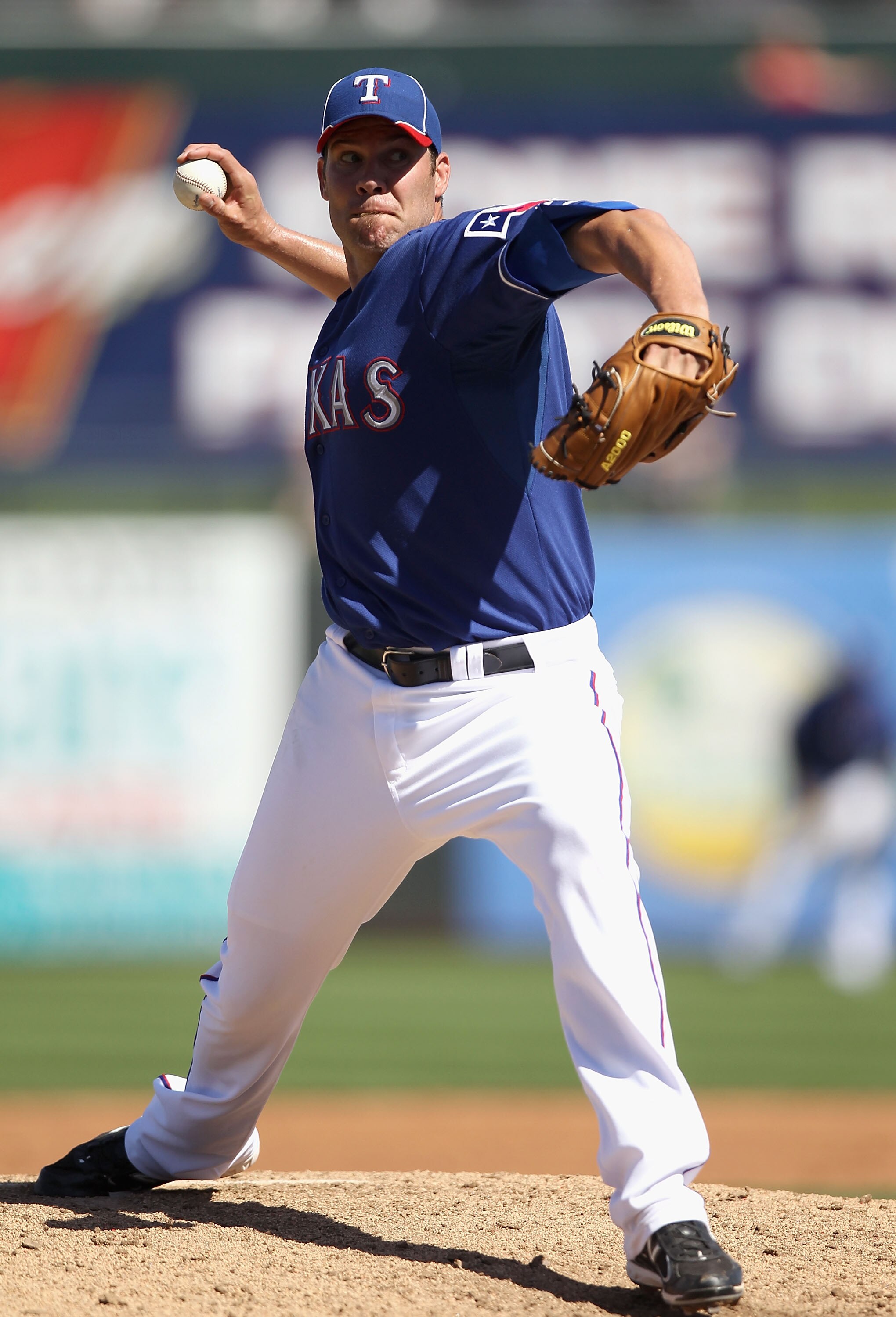 SURPRISE, AZ - MARCH 11:  Starting pitcher Colby Lewis #48 of the Texas Rangers pitches against the Cincinnati Reds during the spring training game at Surprise Stadium on March 11, 2011 in Surprise, Arizona.  (Photo by Christian Petersen/Getty Images)