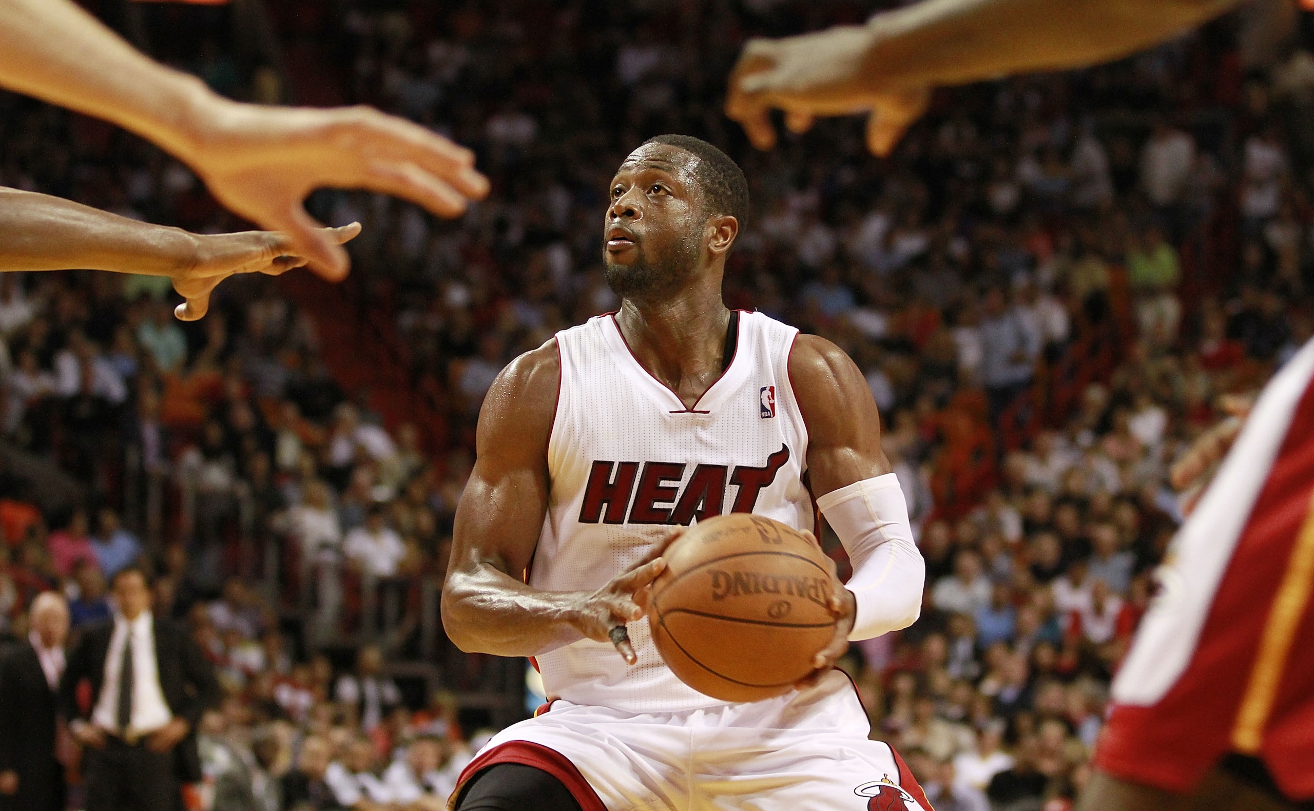 MIAMI, FL - MARCH 25:  Guard Dwyane Wade #3 of the Miami Heat drives against the Philadelphia 76ers at American Airlines Arena on March 25, 2011 in Miami, Florida. The Heat defeated the Sixers 111-99. NOTE TO USER: User expressly acknowledges and agrees t