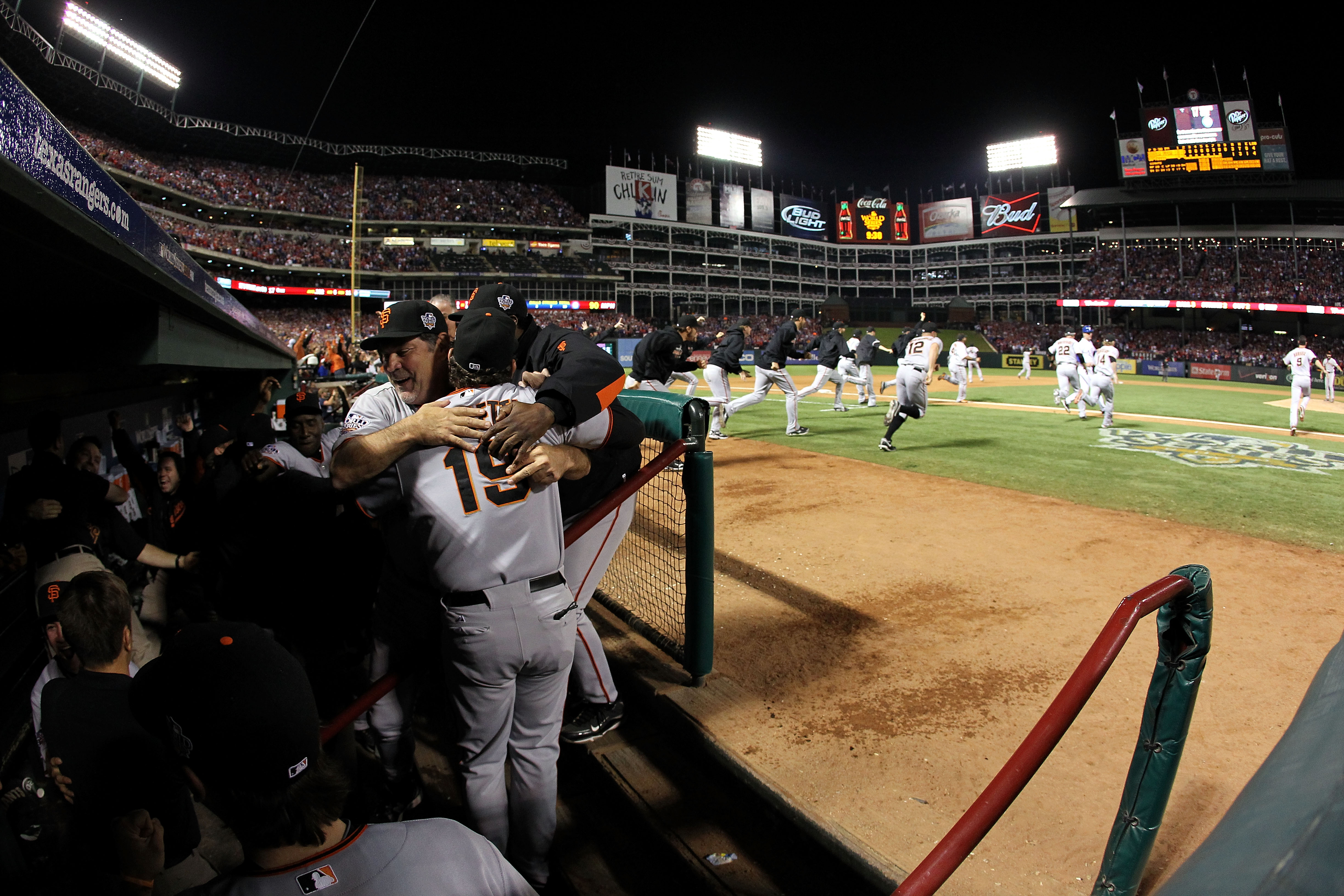 ARLINGTON, TX - NOVEMBER 01:  Manager Bruce Bochy #15 of the San Francisco Giants hugs Dave Righetti #19 after their 3-1 victory to win the World Series over the Texas Rangers in Game Five of the 2010 MLB World Series at Rangers Ballpark in Arlington on N
