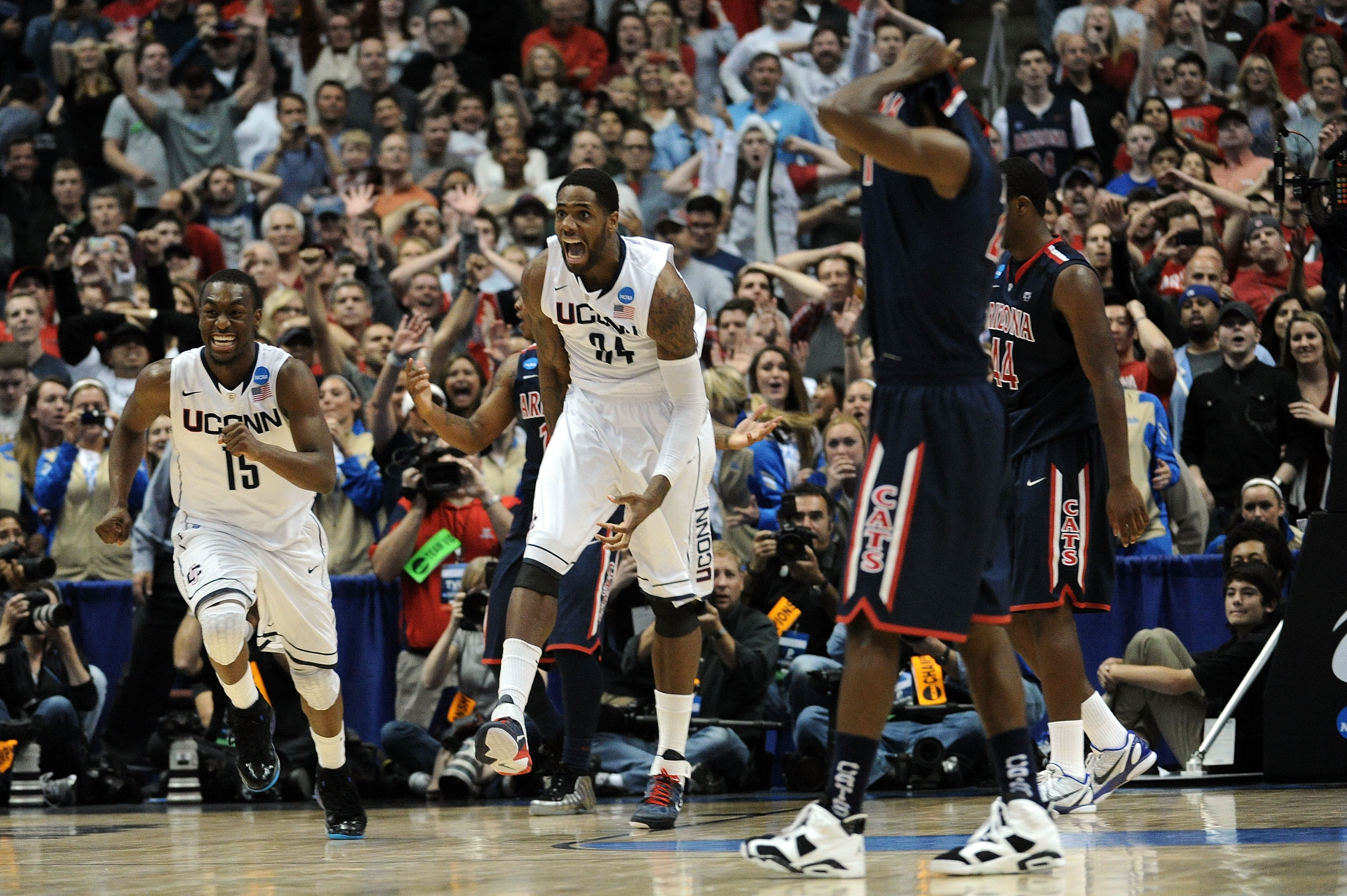 ANAHEIM, CA - MARCH 26:  Kemba Walker #15,  and Alex Oriakhi #34 of the Connecticut Huskies celebrate after defeating the Arizona Wildcats during the west regional final of the 2011 NCAA men's basketball tournament at the Honda Center on March 26, 2011 in