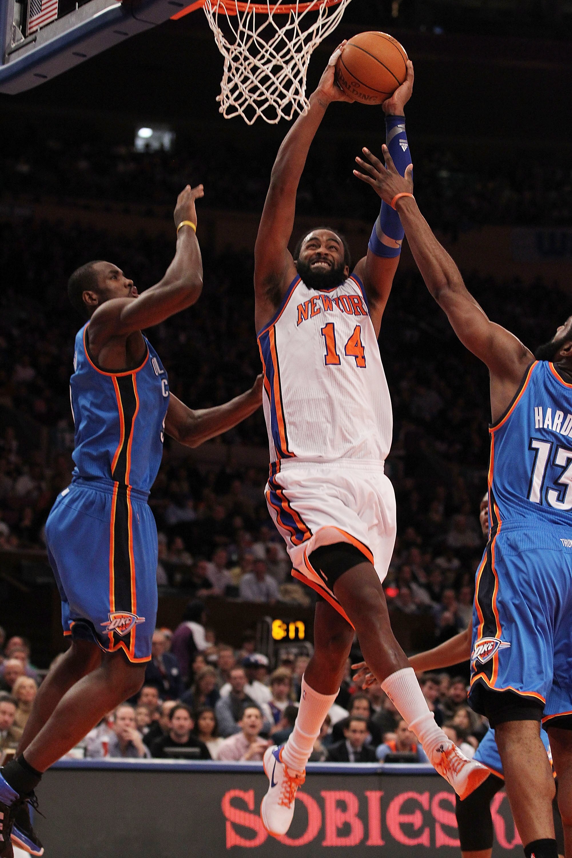 NEW YORK, NY - DECEMBER 22:  Ronny Turiaf #14 of the New York Knicks scores against the Oklahoma City Thunder at Madison Square Garden on December 22, 2010 in New York City.   NOTE TO USER: User expressly acknowledges and agrees that, by downloading and/o