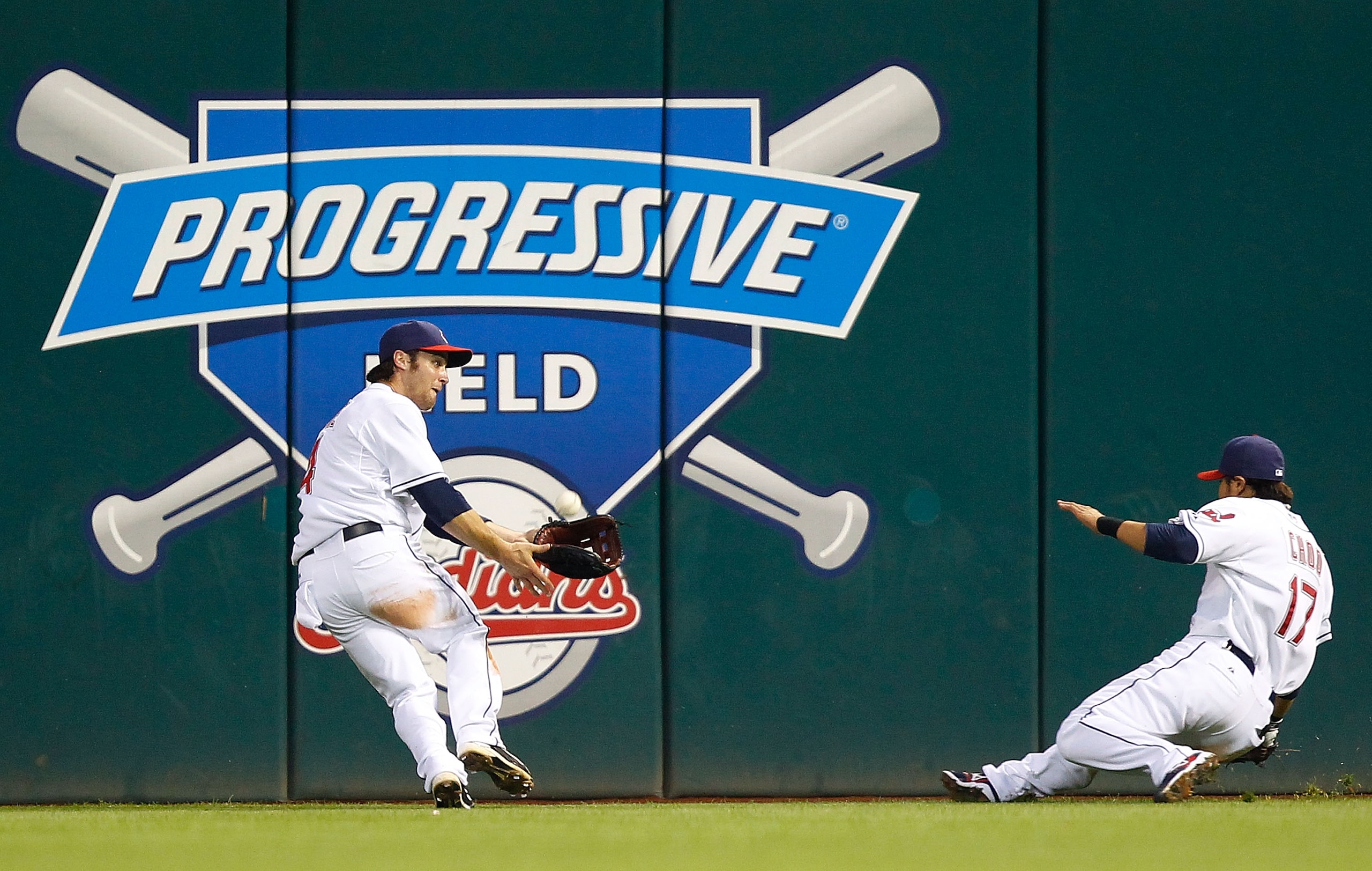 CLEVELAND - JUNE 11:  Trevor Crowe #4 of the Cleveland Indians makes a catch in front of teammate Shin-Soo Choo #17 against the Washington Nationals during the game on June 11, 2010 at Progressive Field in Cleveland, Ohio.  (Photo by Jared Wickerham/Getty