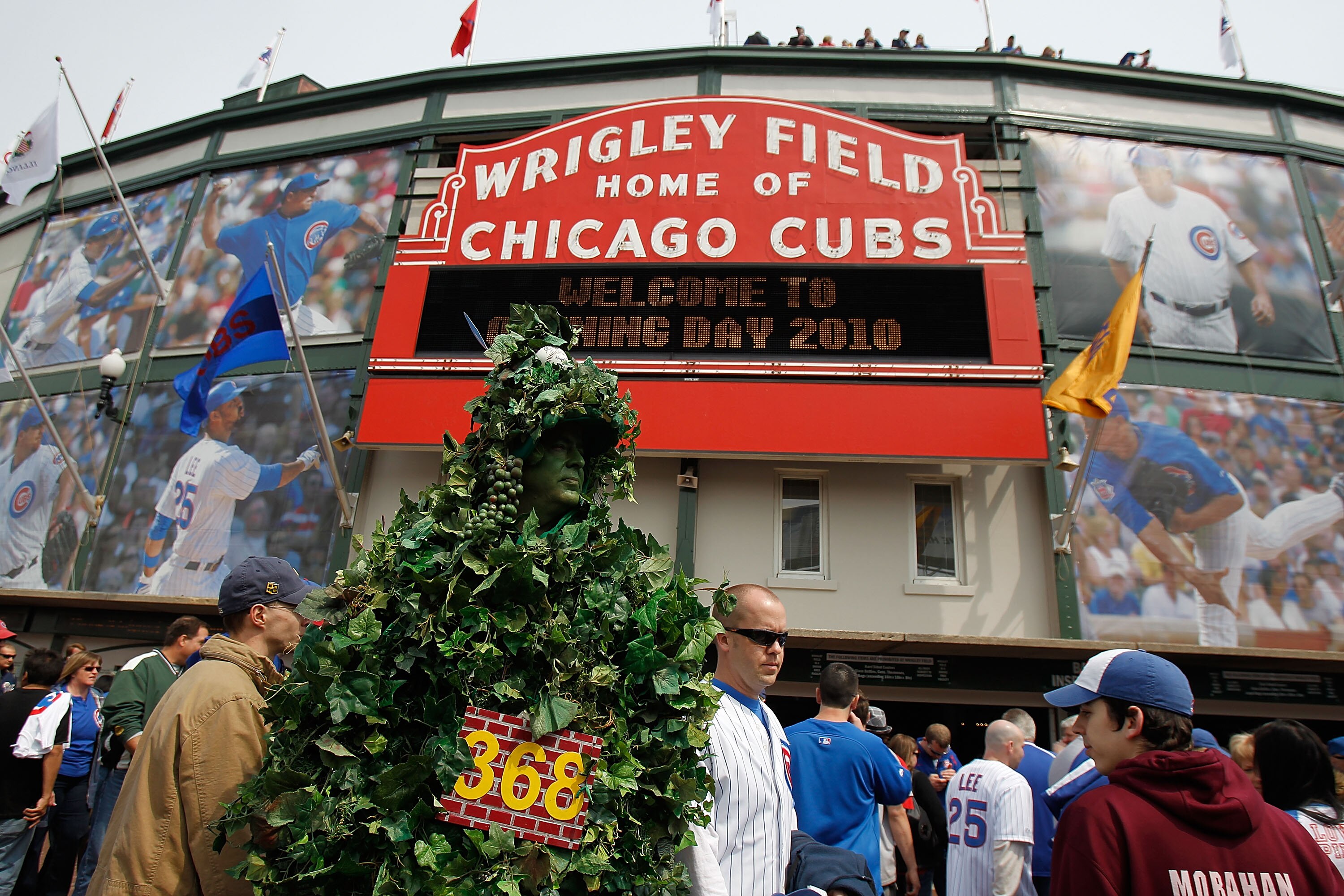 CHICAGO - APRIL 12: A fan dressed as the outfield ivy wall walks in front of Wrigley Field before the Opening Day game between the Chicago Cubs and the Milwaukee Brewers on April 12, 2010 in Chicago, Illinois. (Photo by Jonathan Daniel/Getty Images)